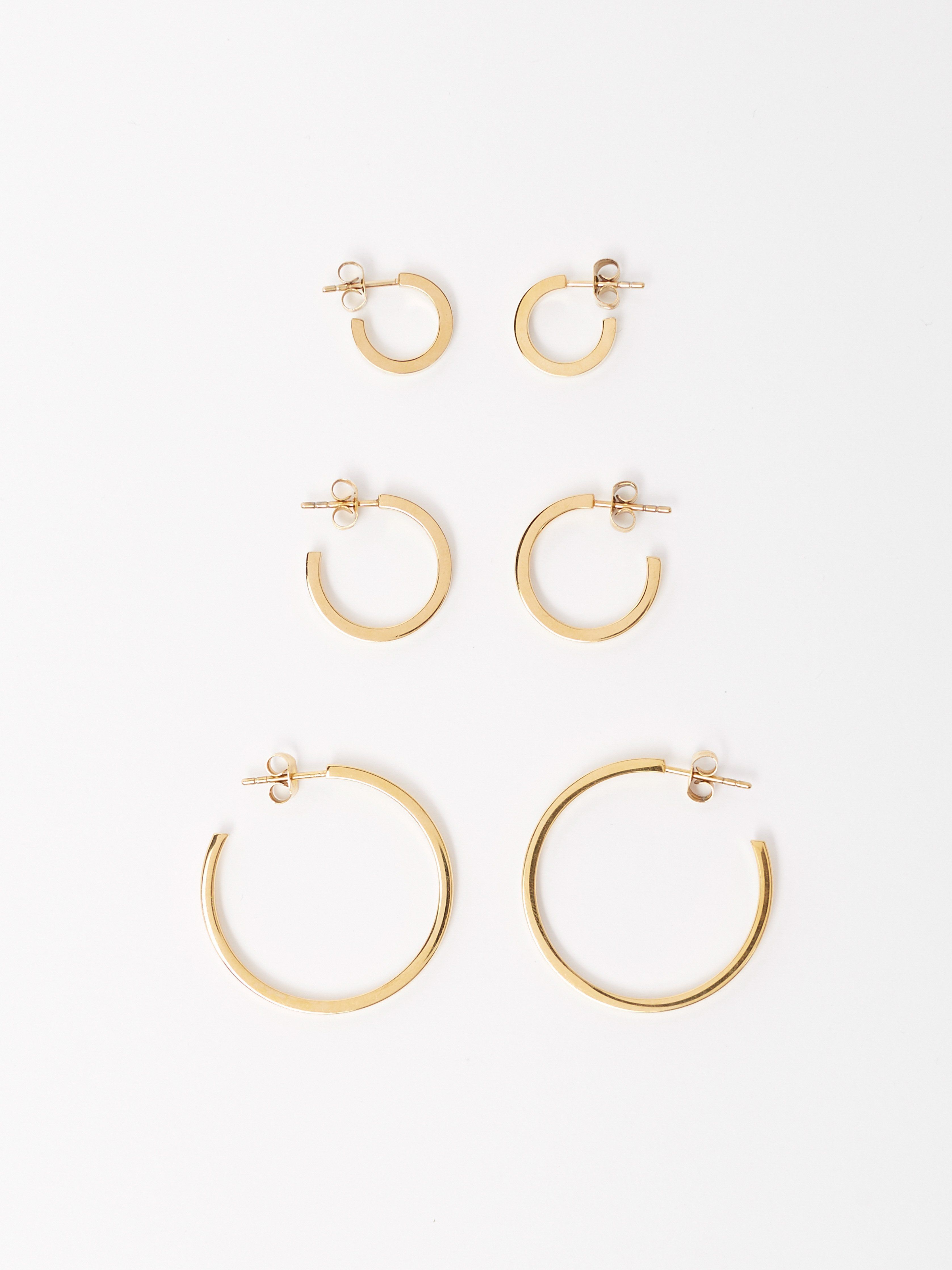 Flat Lay of Simple Gold Hoops Collection including the Mini Simple Gold Hoops Earrings Bagatiba 