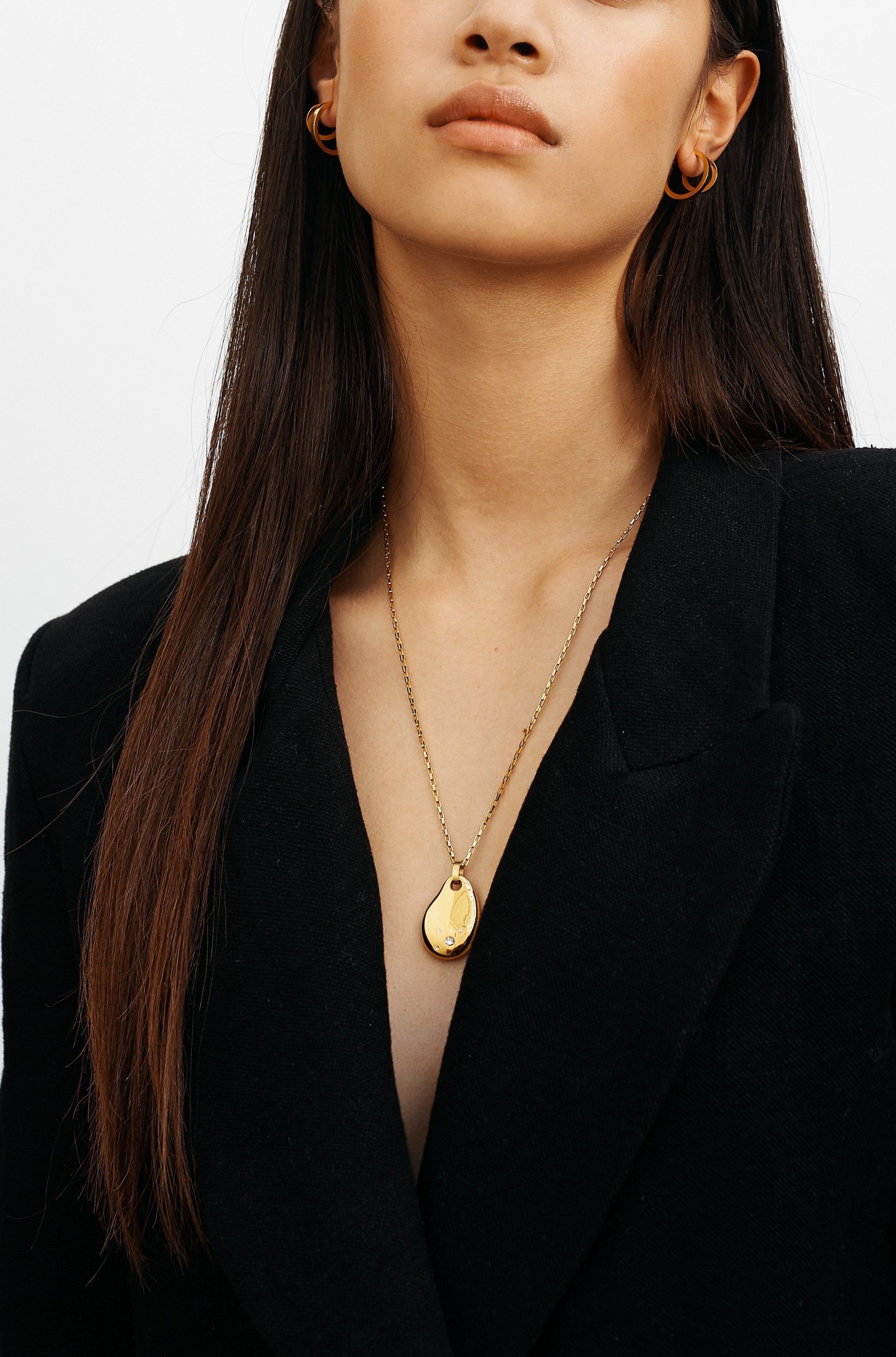 Full view of model wearing Mini Simple Gold Hoops Earrings Bagatiba 