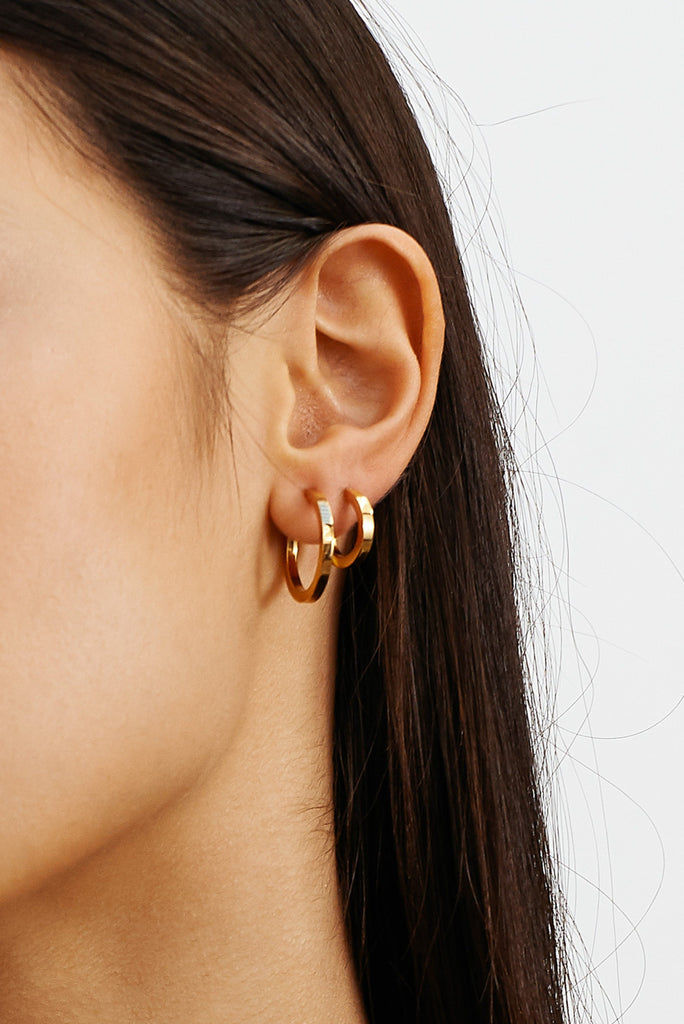 Detail view on model of Mini Simple Gold Hoops Earrings Bagatiba 