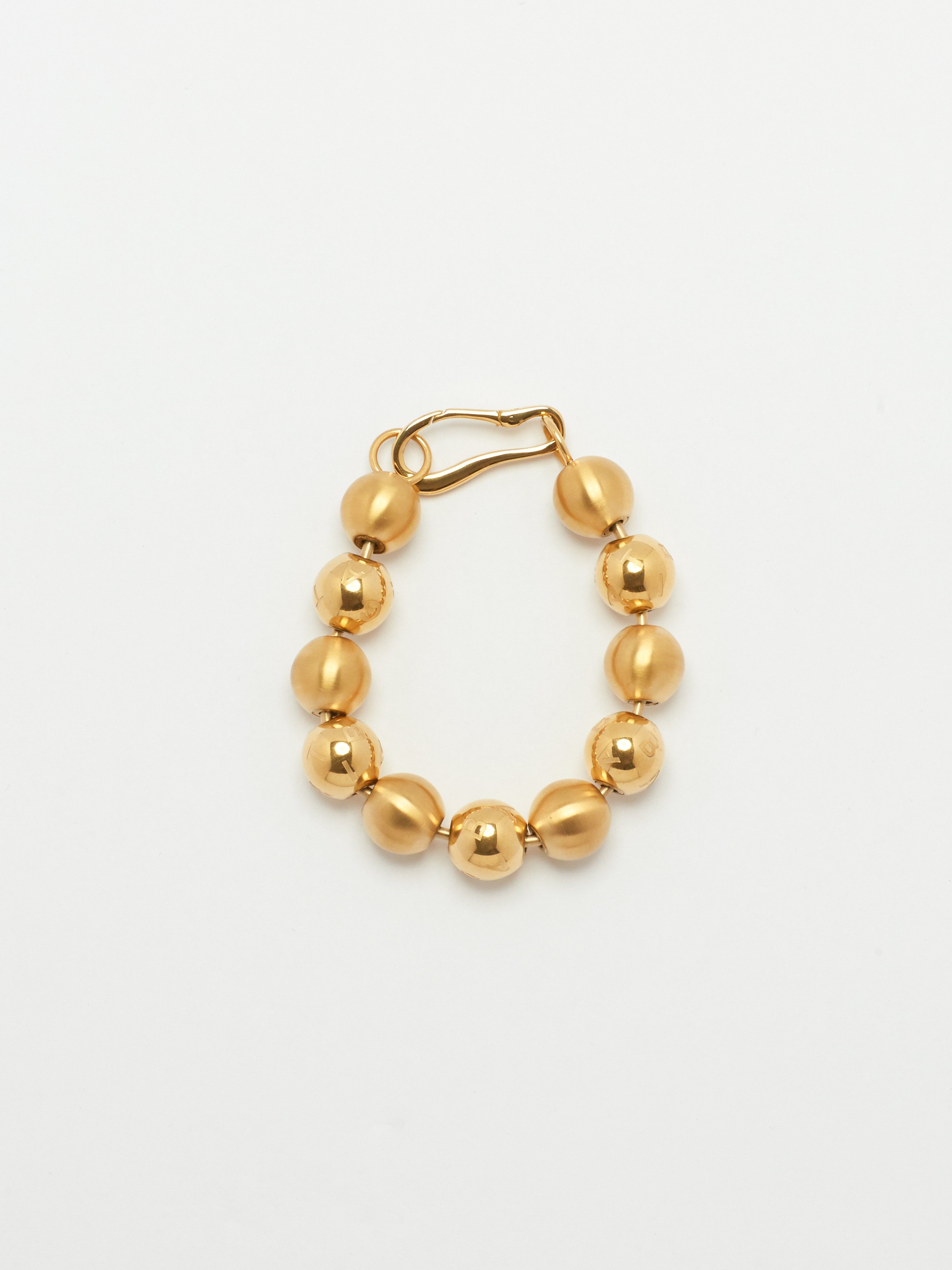 Flat lay of Mixed Sphere Bracelet Necklace bagatiba 