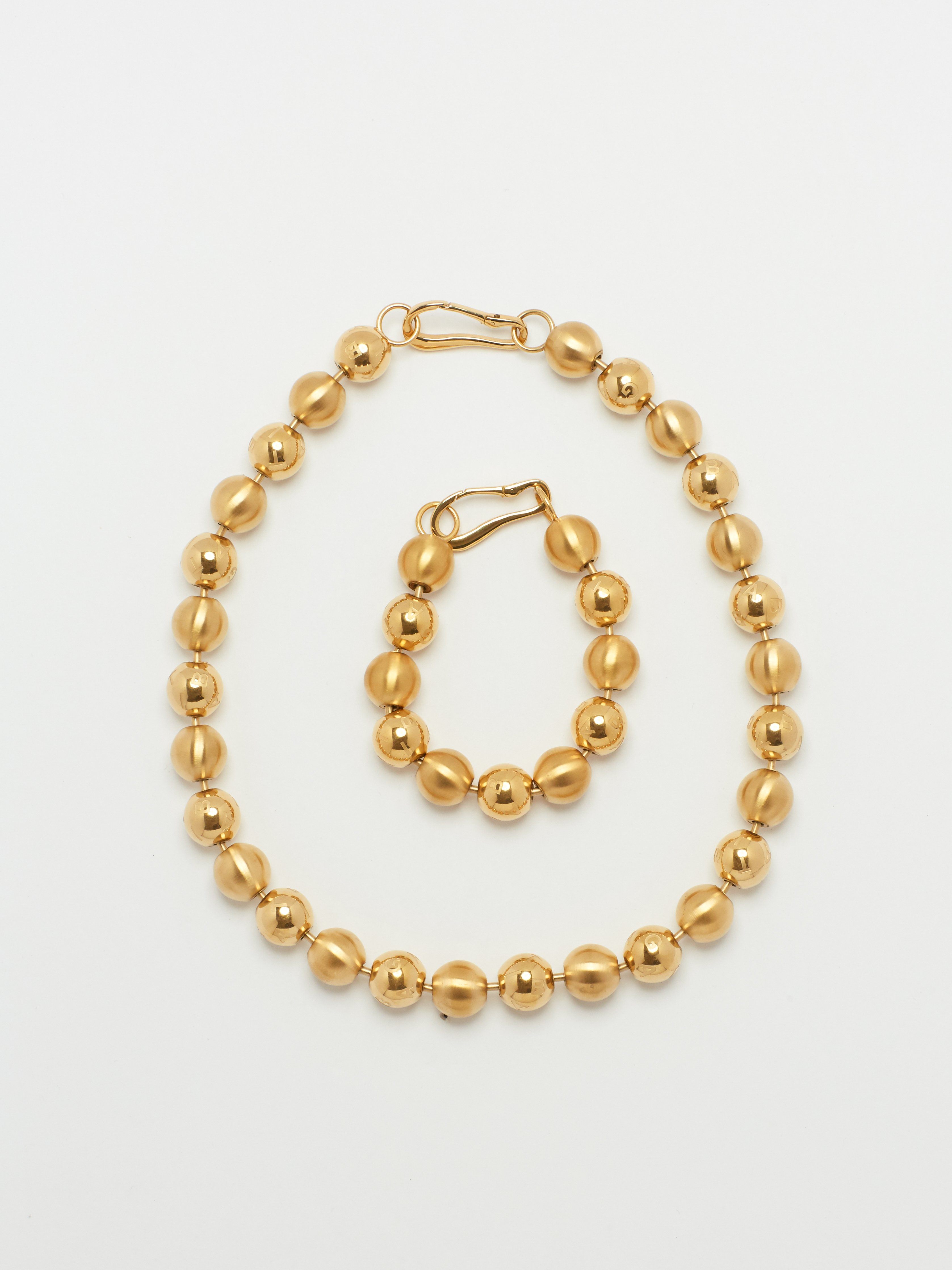 Full view flat lay of Mixed Sphere Necklace and Bracelet  bagatiba 