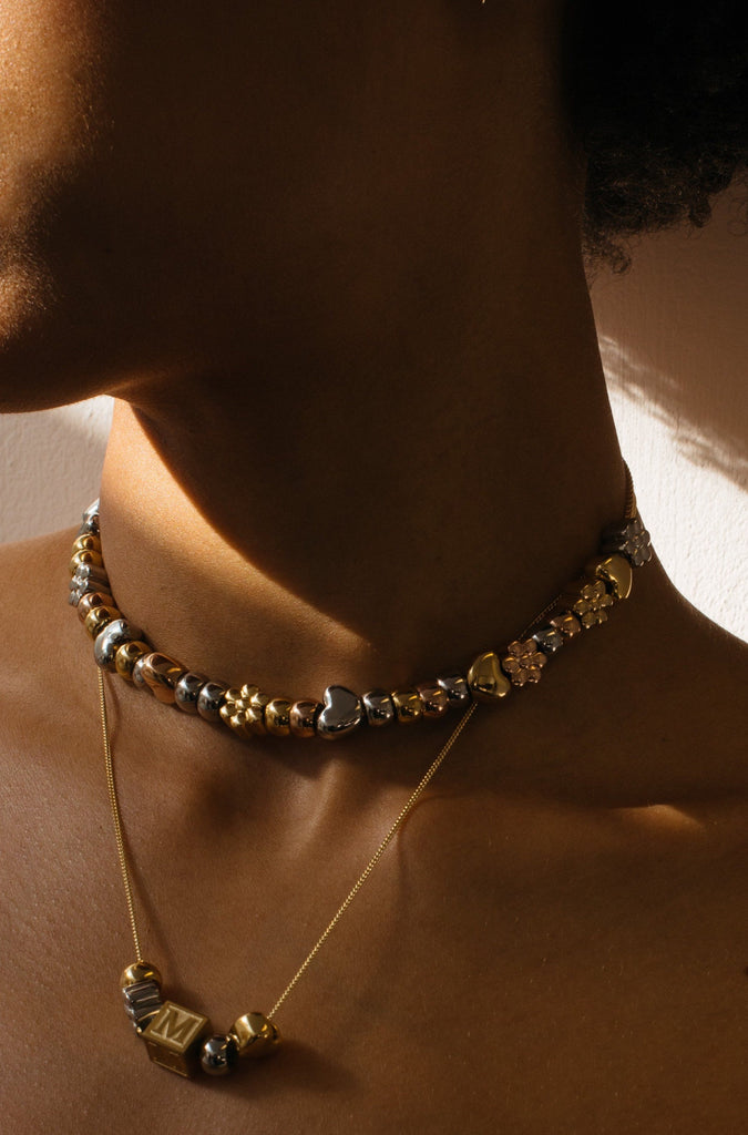 Profile view of model wearing Multi Beaded Necklace Choker Bagatiba 