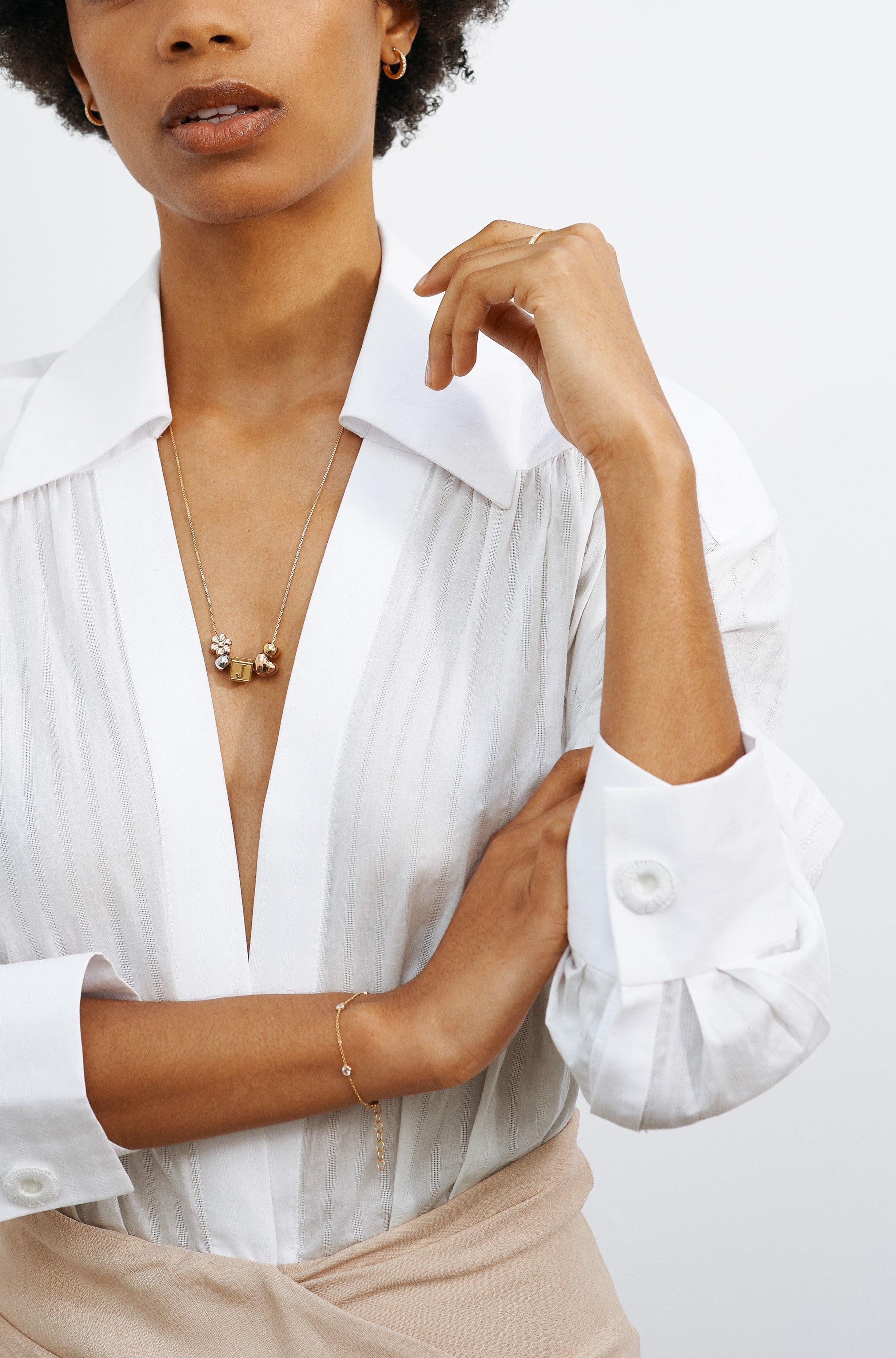 Model wearing vintage square chain with Letter Block letters and multi bead set  Bagatiba 