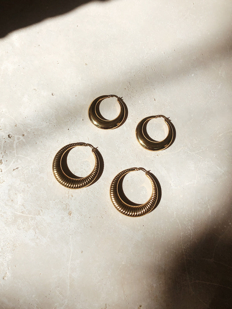 Orb & Spiral Hoops flat lay in natural light