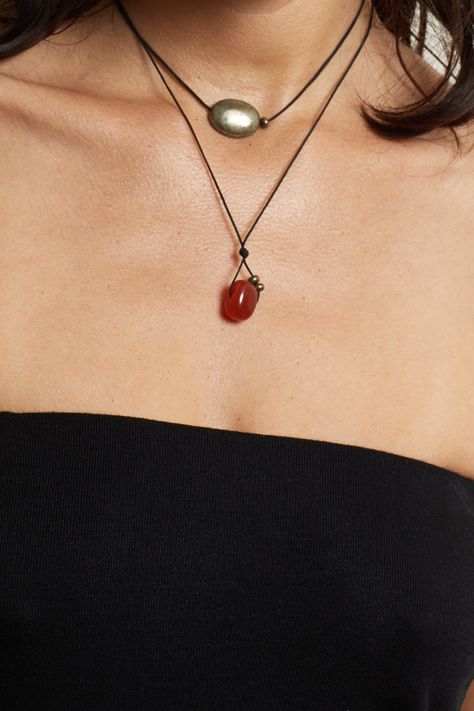 Oval Pyrite Necklace necklace close up on model skin