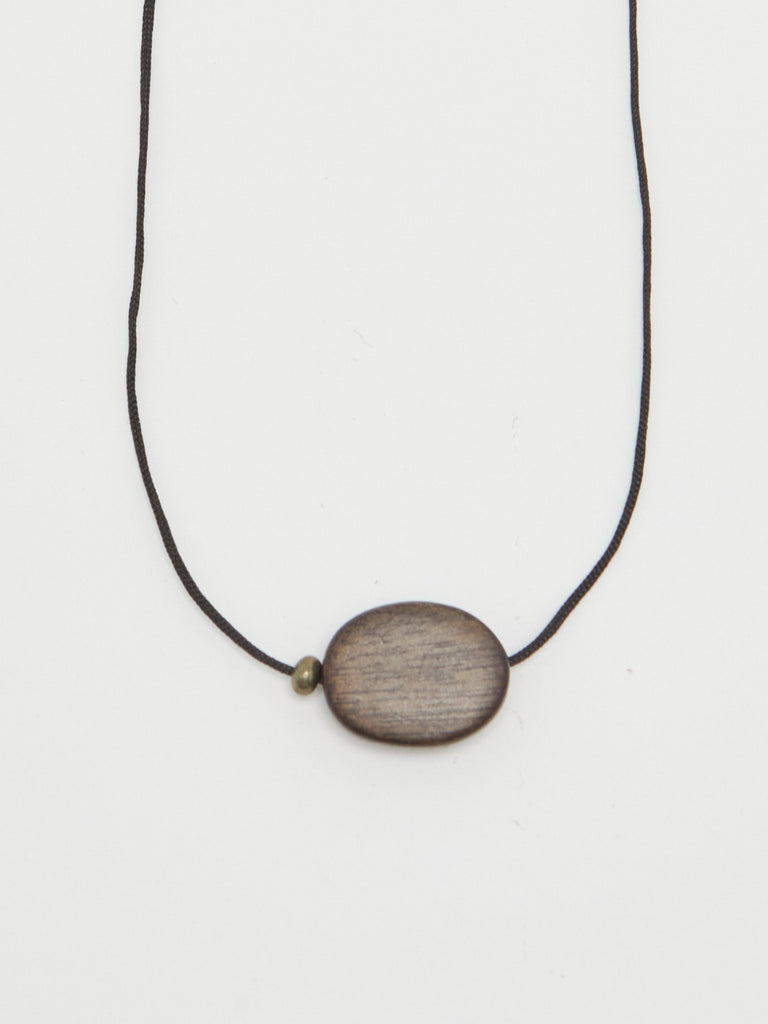 Oval Wood Bead Necklace necklace close up flat lay