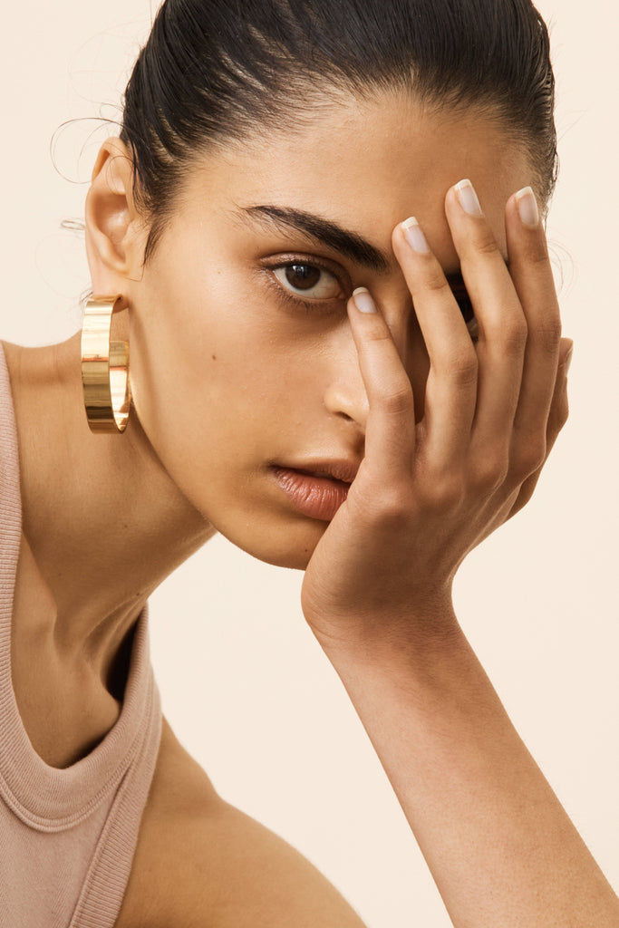 Model wearing Oversized Roma Hoops Earrings by Bagatiba 