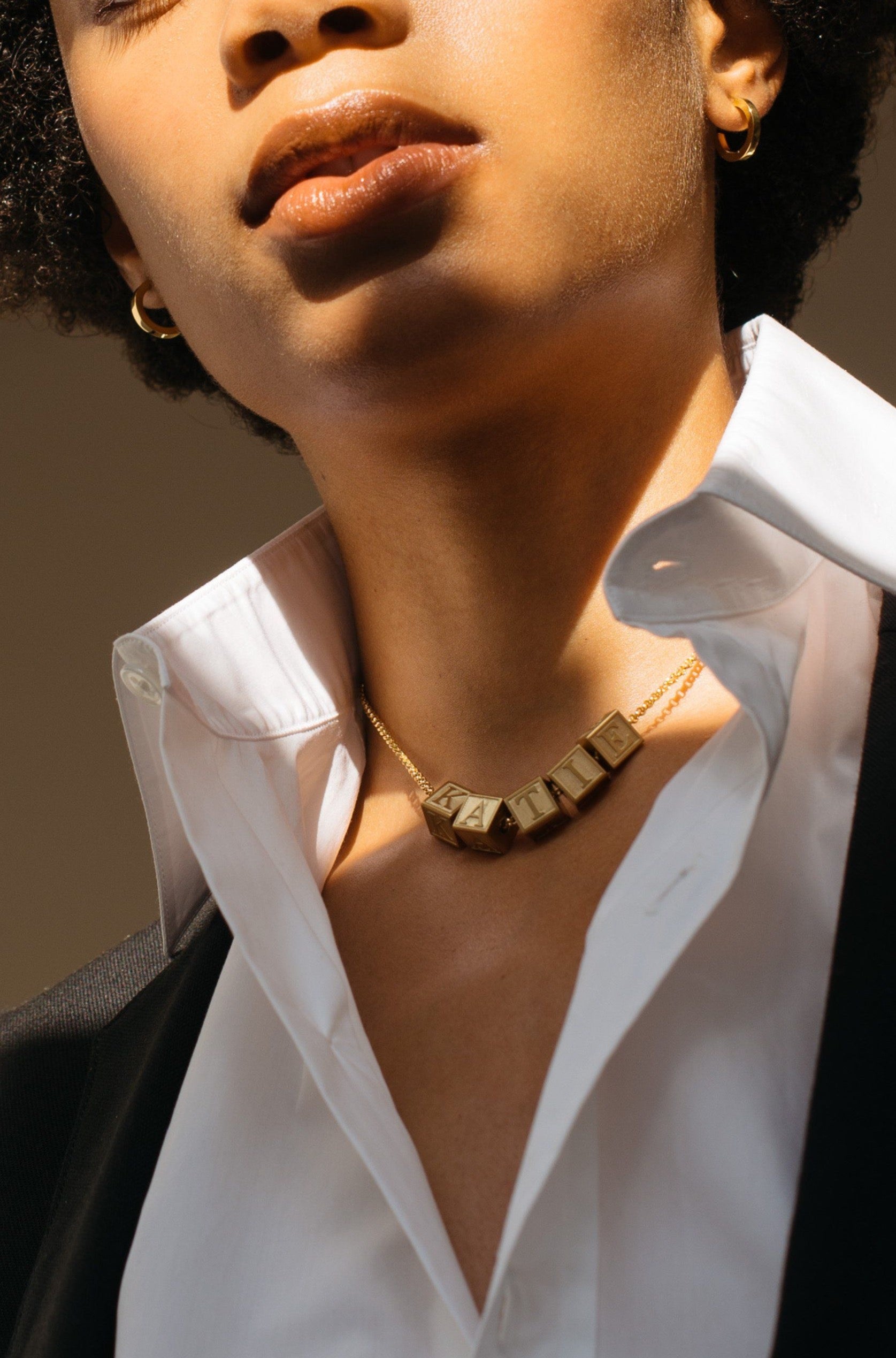 Model wearing 5 Letter Block letters on choker chain Bagatiba