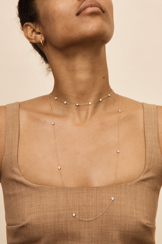 Cropped view of model wearing the Princess Belly Chain Necklace and the choker by  Bagatiba 