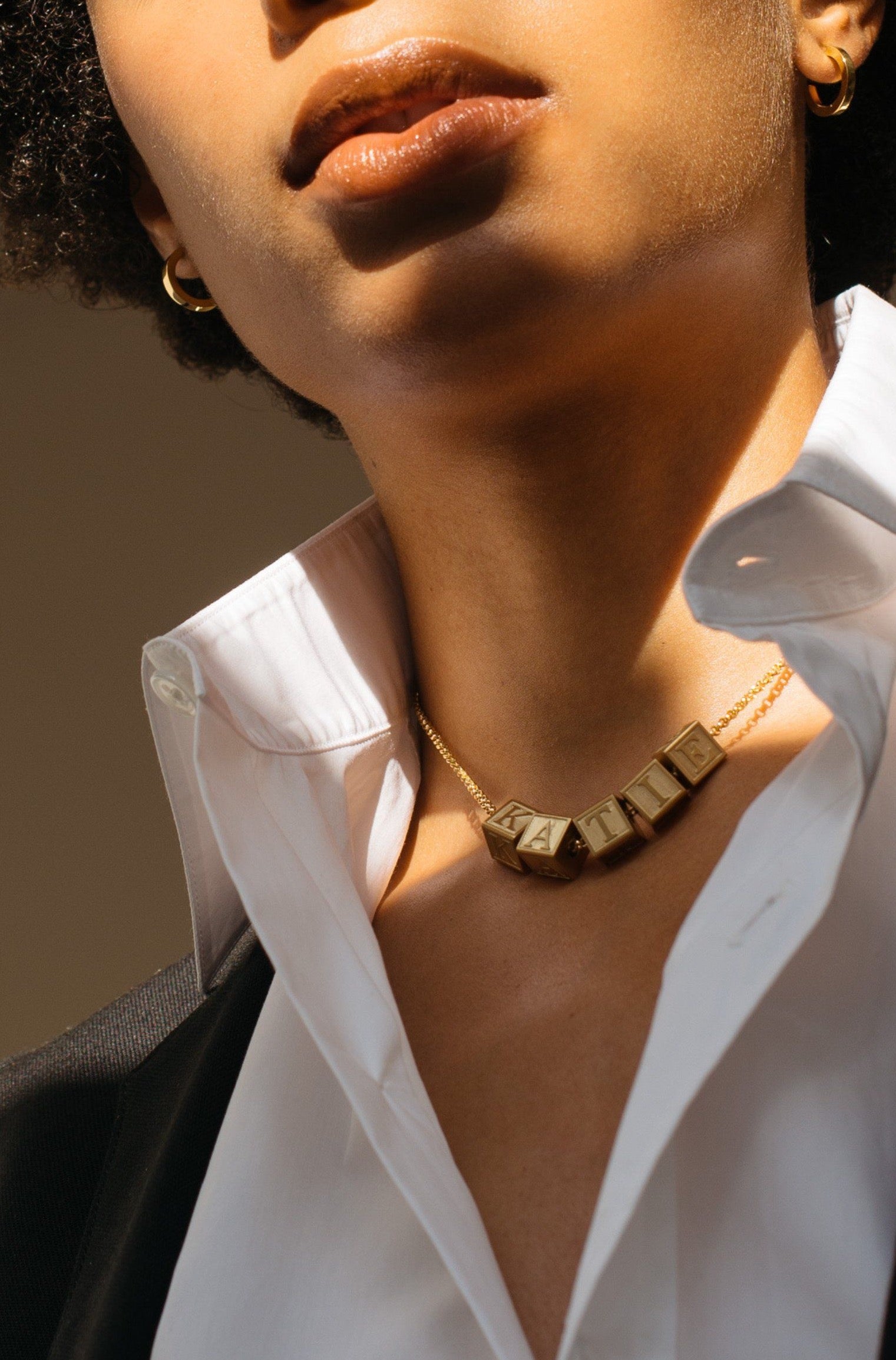 Model wearing 5 Letter Block letters on choker chain Bagatiba