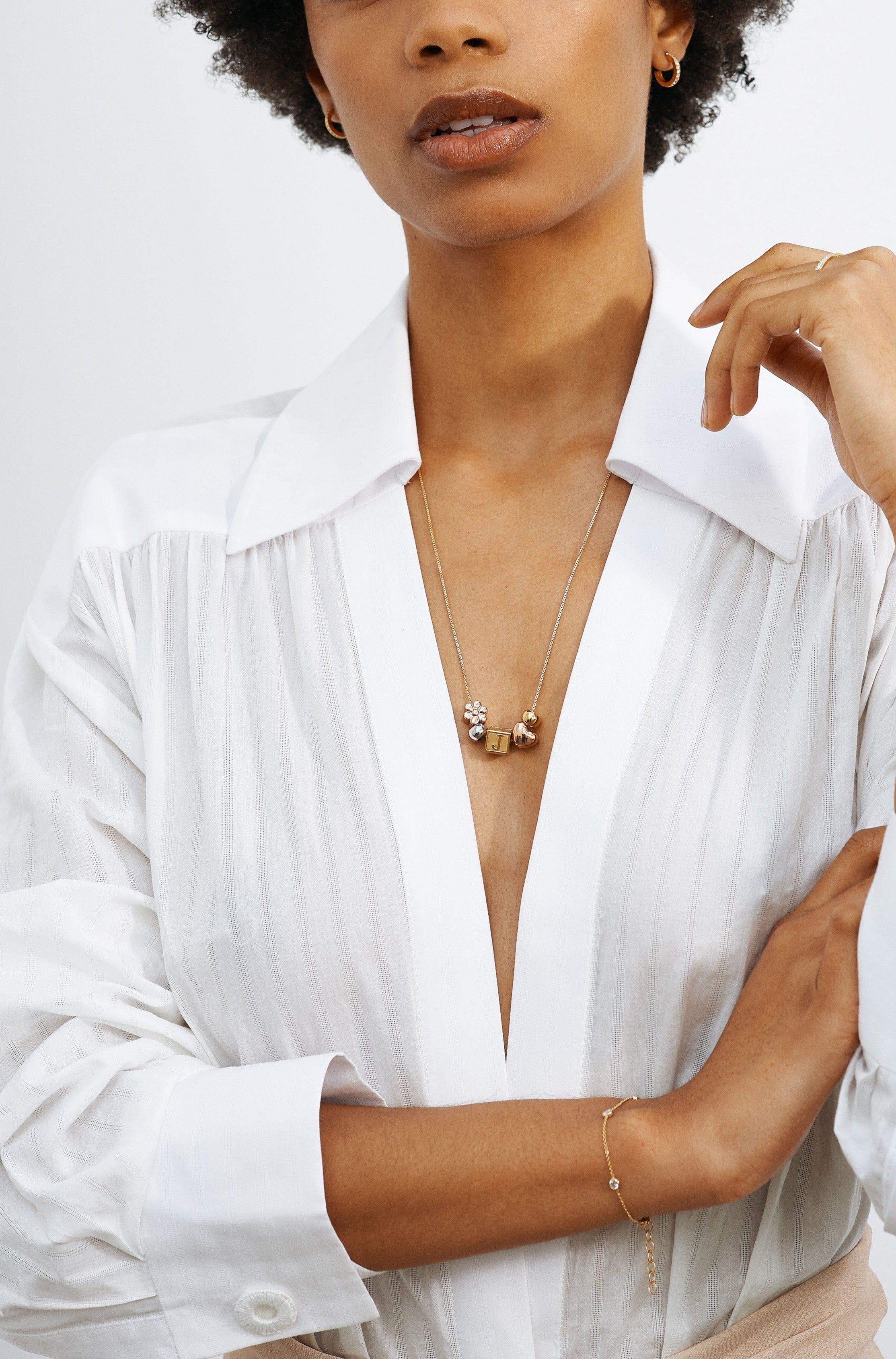 Model wearing vintage square chain with Letter Block letters and multi bead set Bagatiba