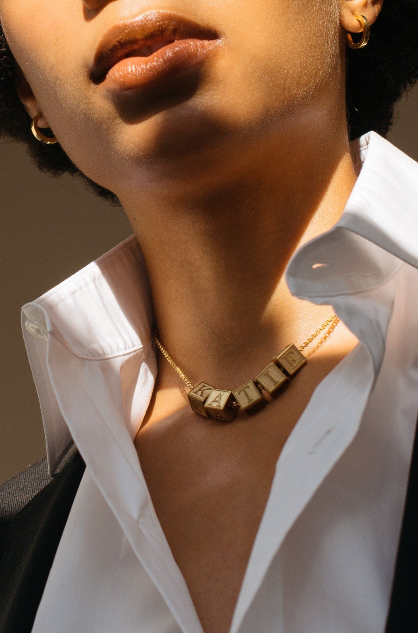 Model wearing 5 Letter Block letters on choker chain Bagatiba