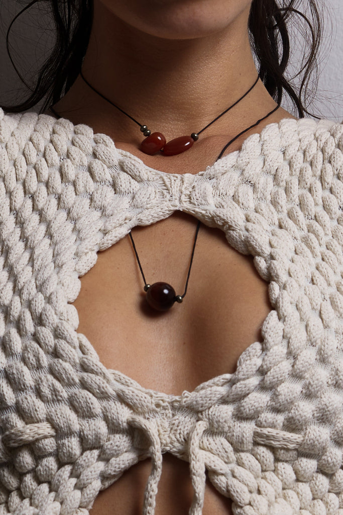 Red Tiger Eye Necklace necklace Bagatiba close up on model wearing white knit top
