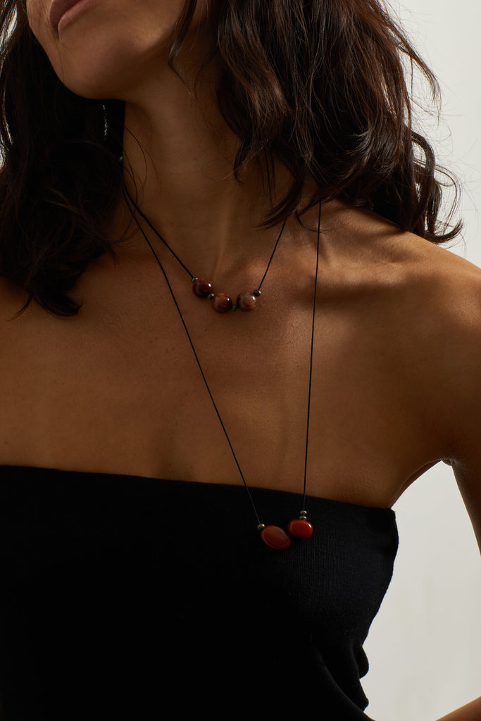 Rutilated Quartz Trio Necklace necklace Bagatiba close up on model posing wearing double red agate and rutilated quartz