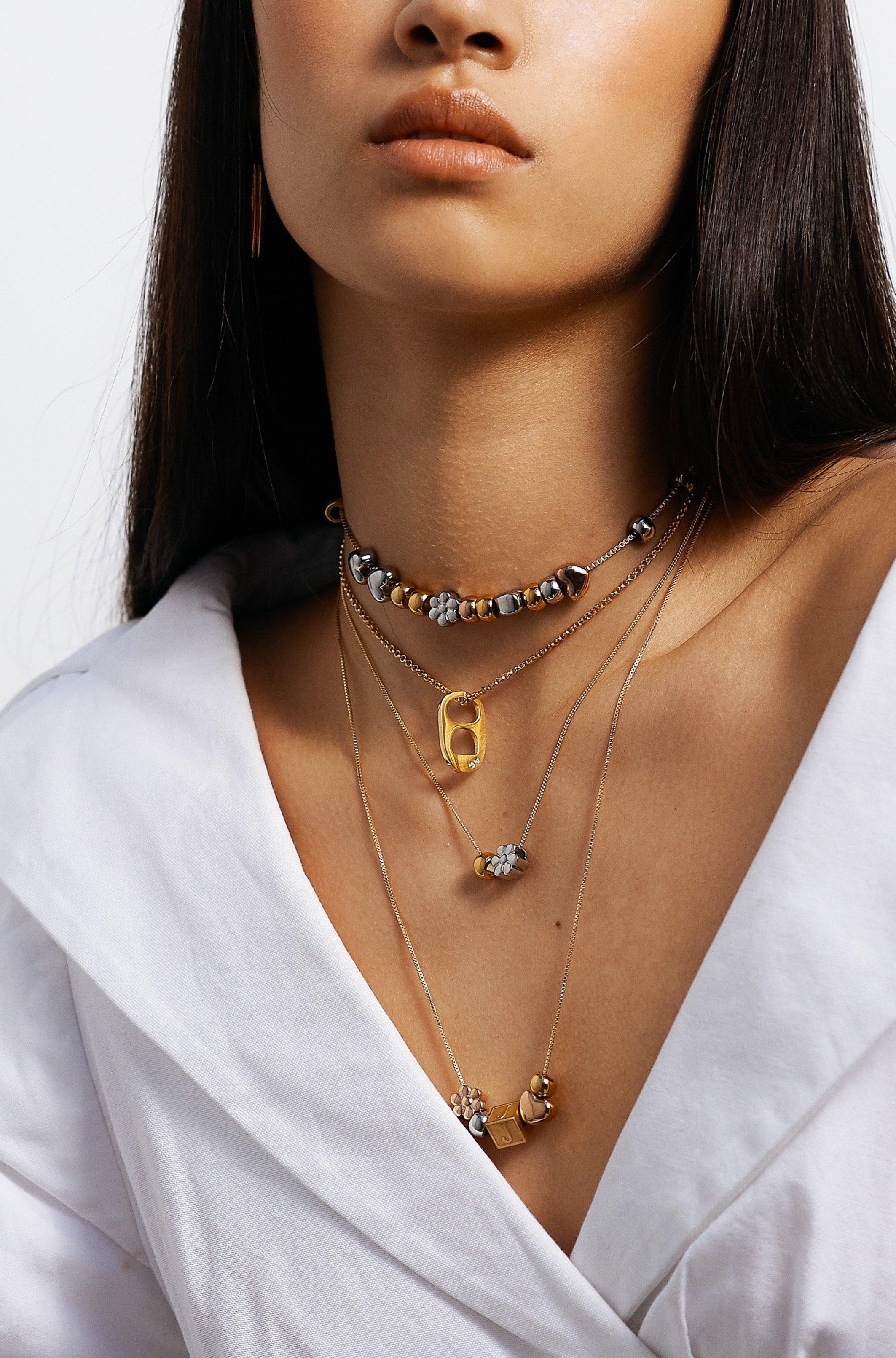 full view of model wearing 4 build it necklaces Bagatiba