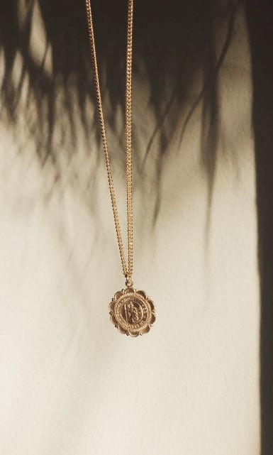 Saint Christopher Crest Necklace by Bagatiba in natural light