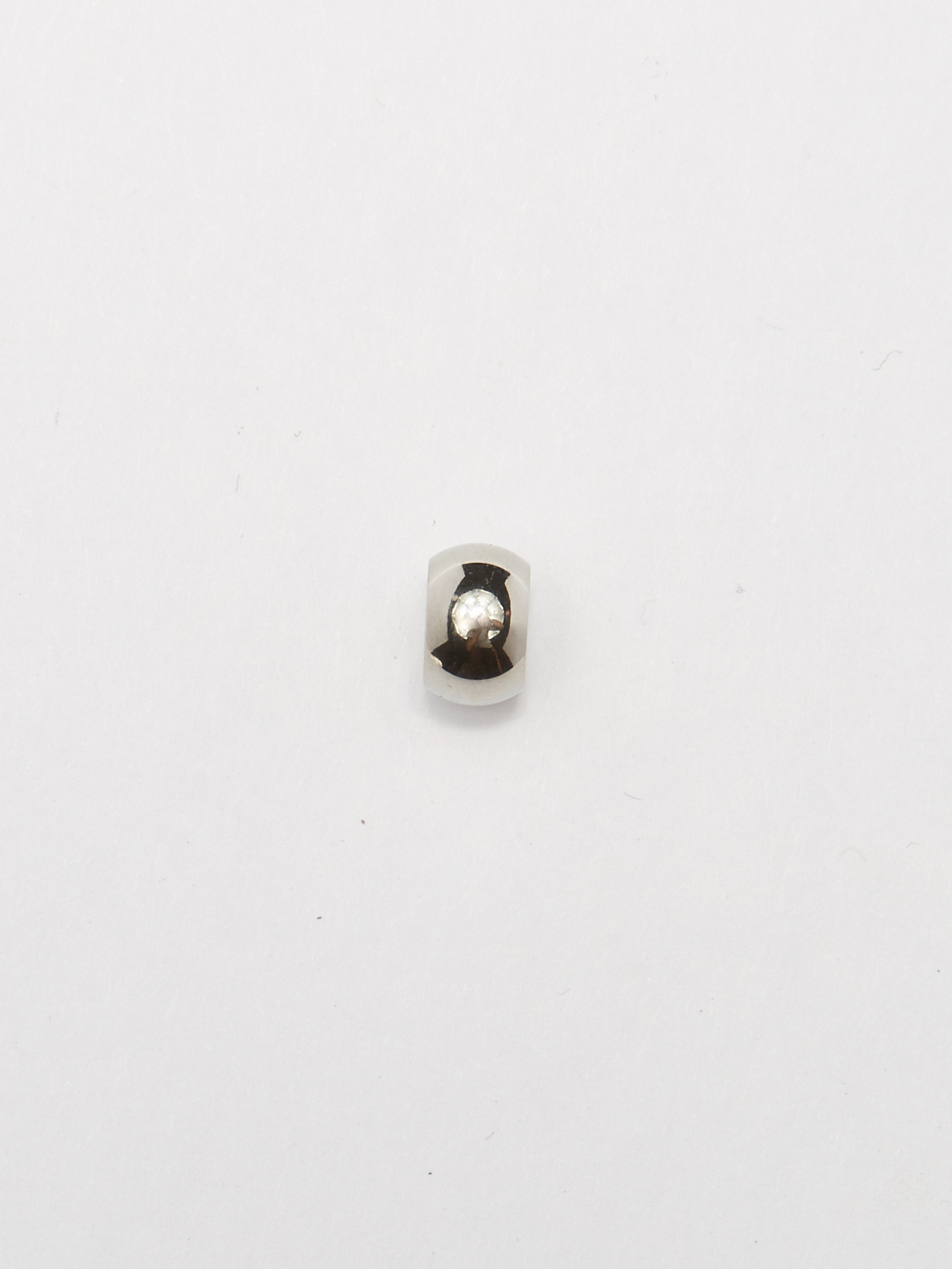 Detail view of bead from the Silver Bead Set Bagatiba