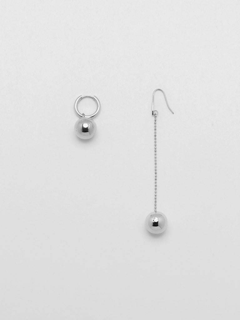 Flat lay of Silver Drop Sphere Earring and Silver Sphere Hoop  Earrings bagatiba 