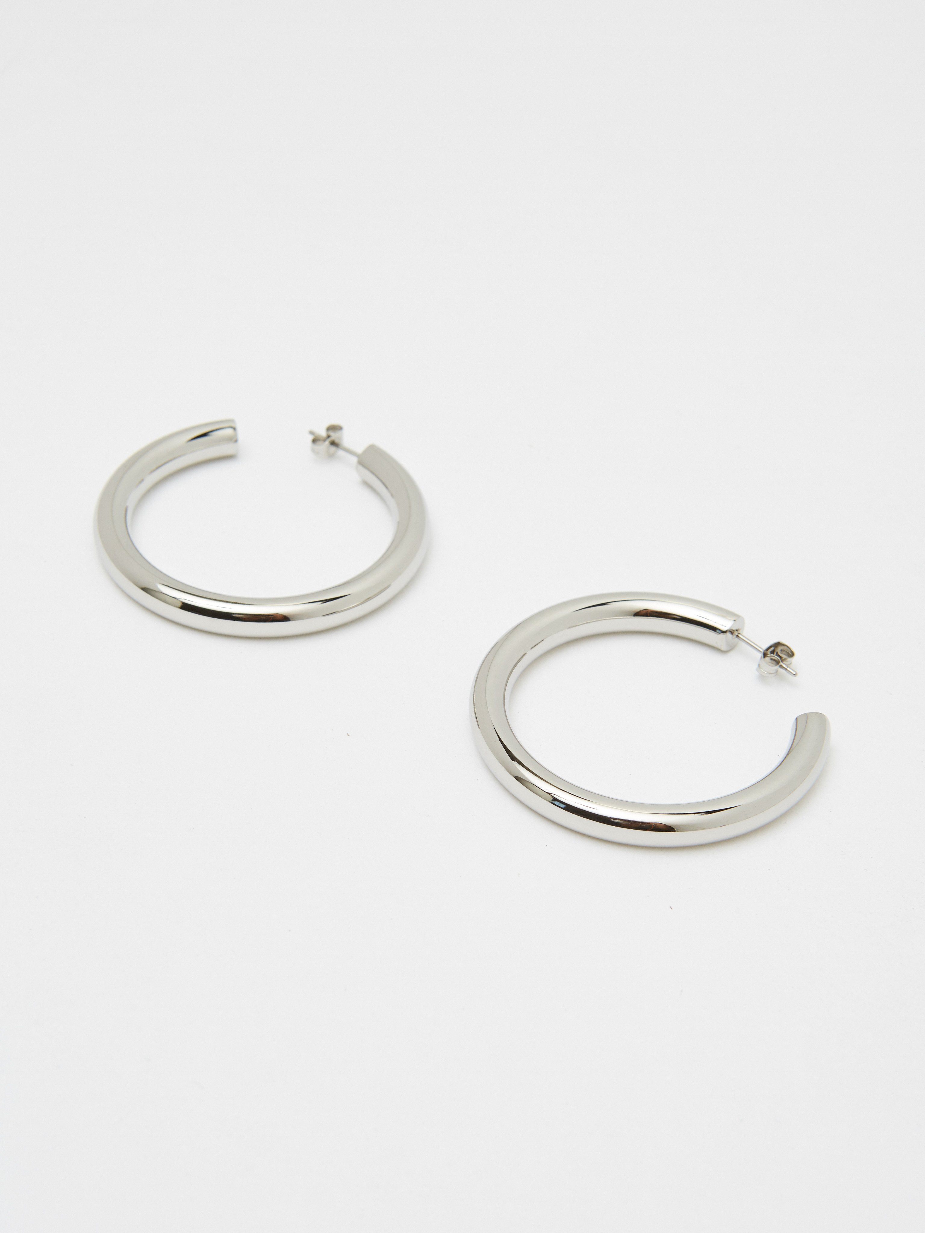 Detailed flat lay view of Silver Hollow Hoops Earrings Bagatiba 