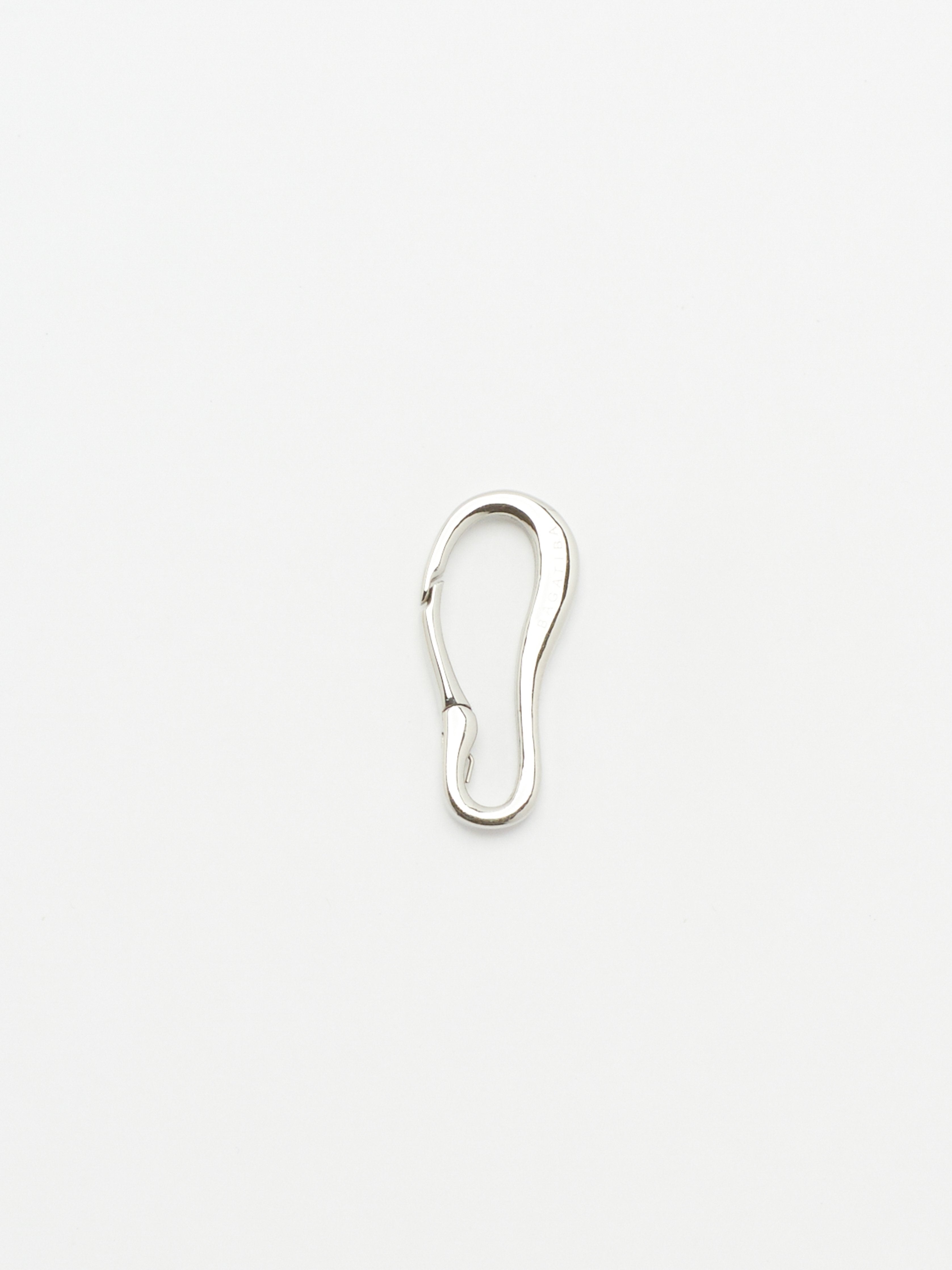 Full view flat lay of Silver Molded Clip Body Bagatiba 