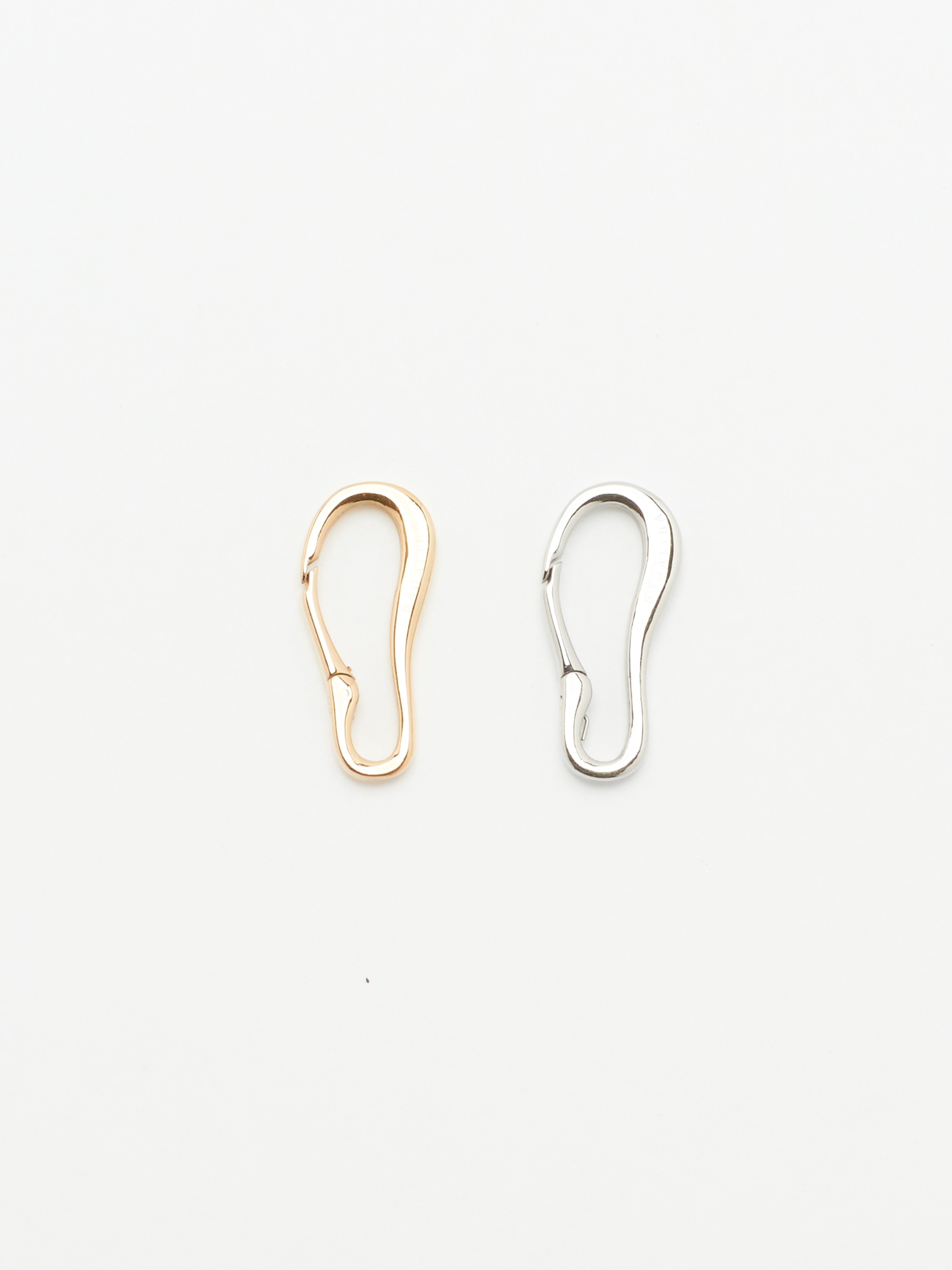 Full view flat lay of Gold and Silver Molded Clips Body Bagatiba 