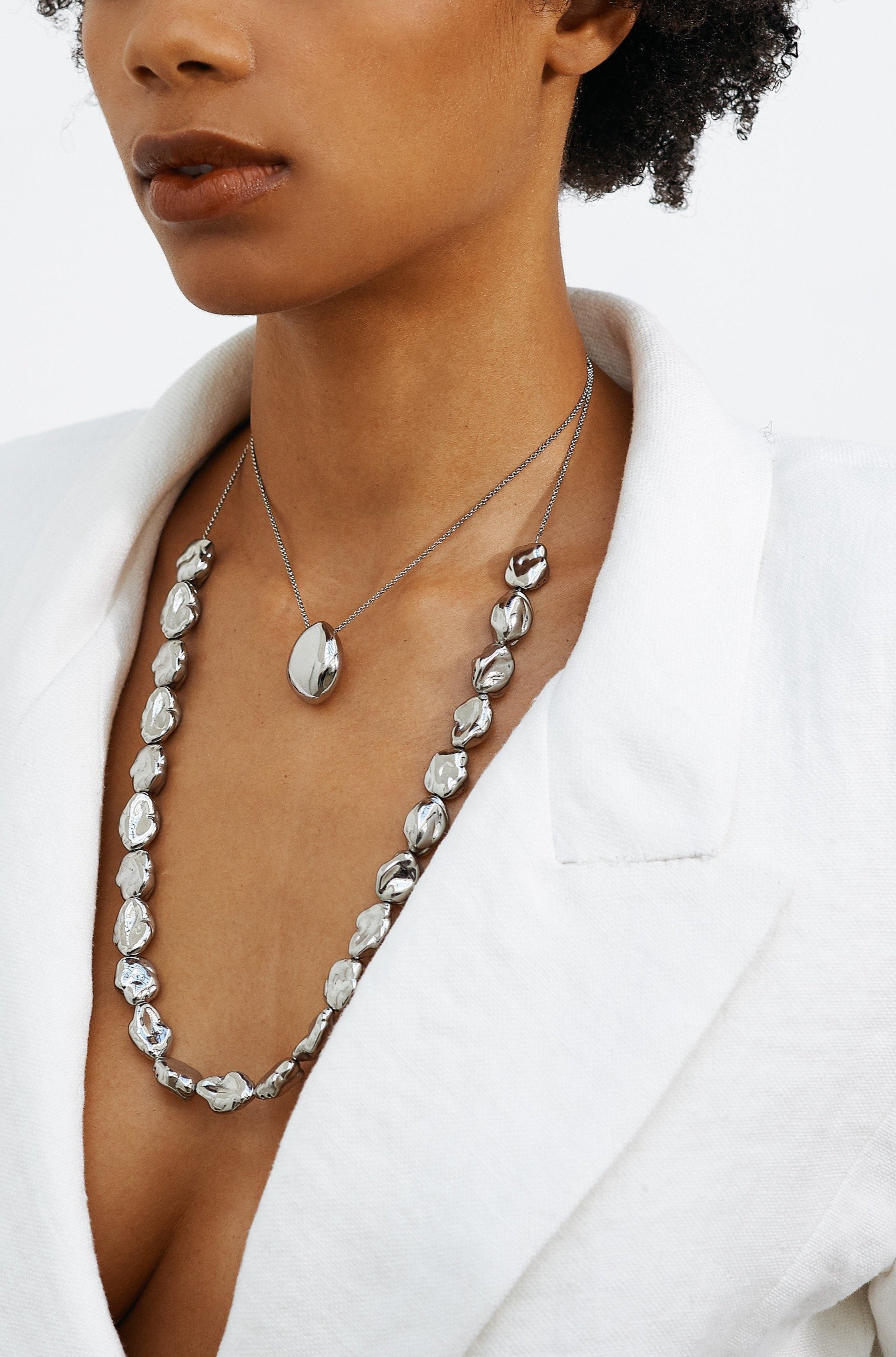 Model profile view of Silver Orb Necklace and Silver Pearl Necklace by bagatiba 