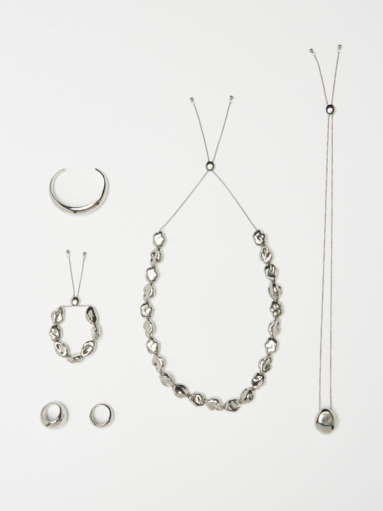 Full view flat lay of Silver Pearl Bracelet, Silver Pearl Necklace and the Silver Orb Collection by bagatiba 