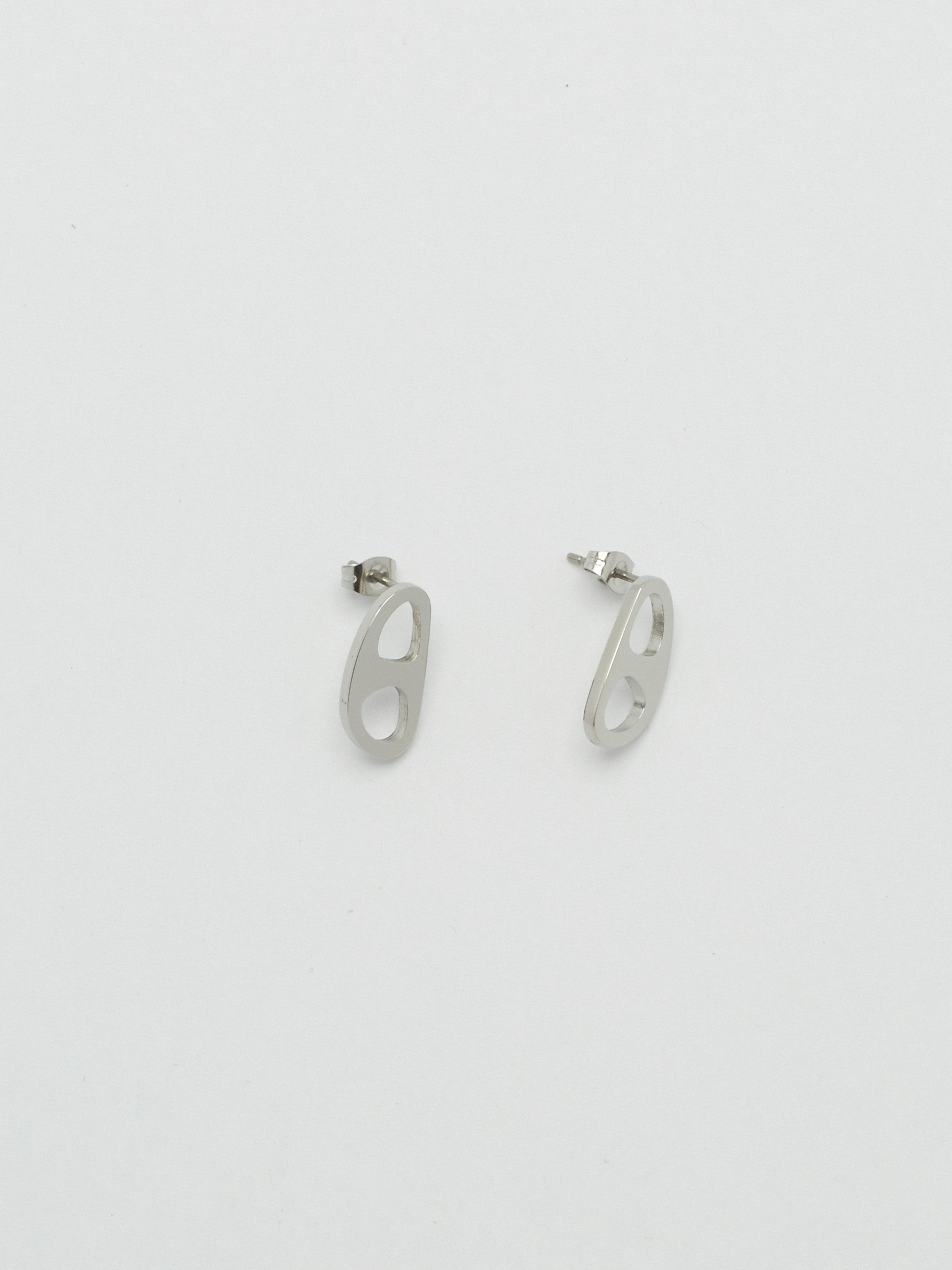 Side view flat lay of Silver Tab Studs Earrings bagatiba 