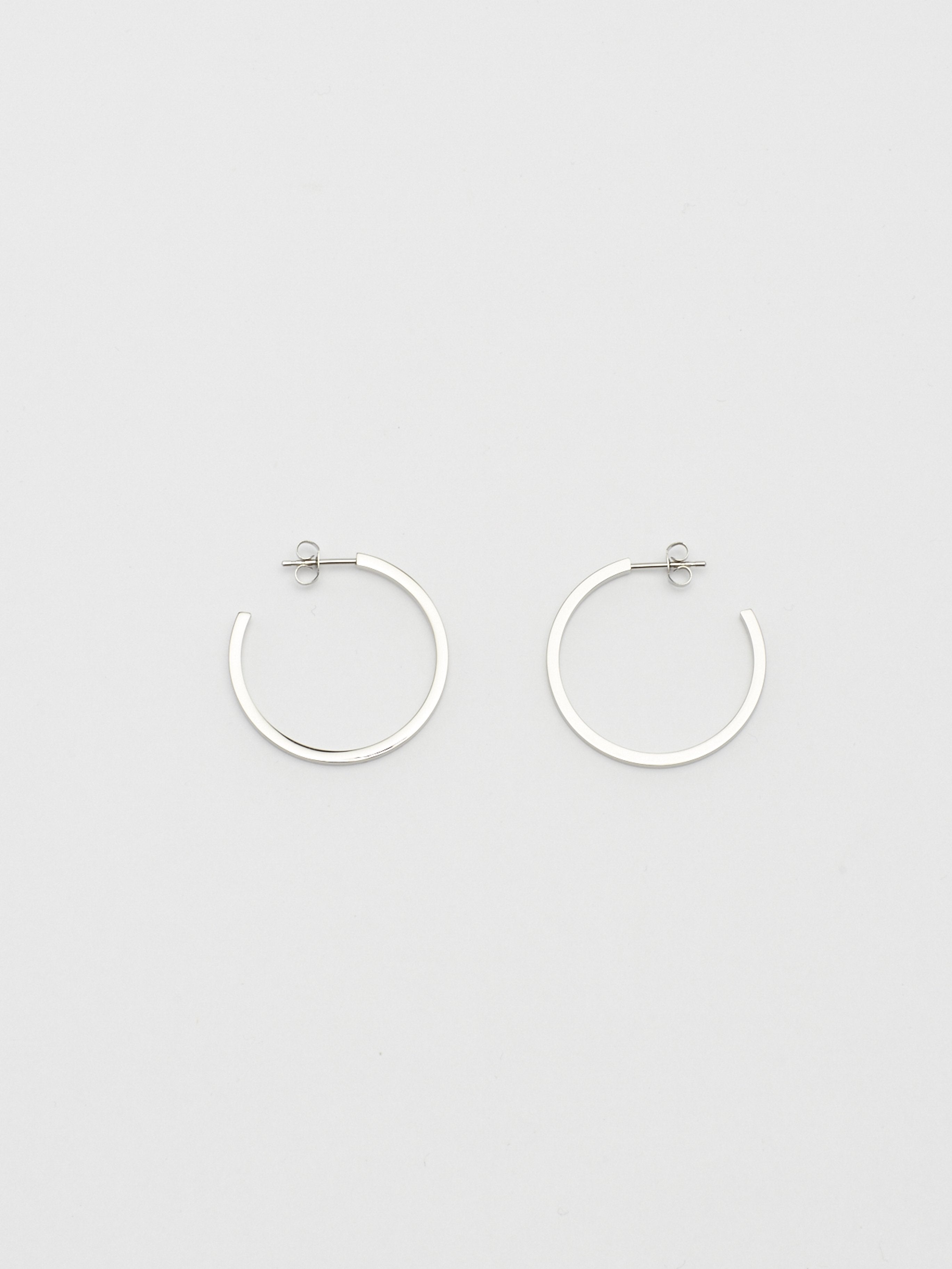 Full view flat lay of Simple Silver Hoops Earrings Bagatiba 