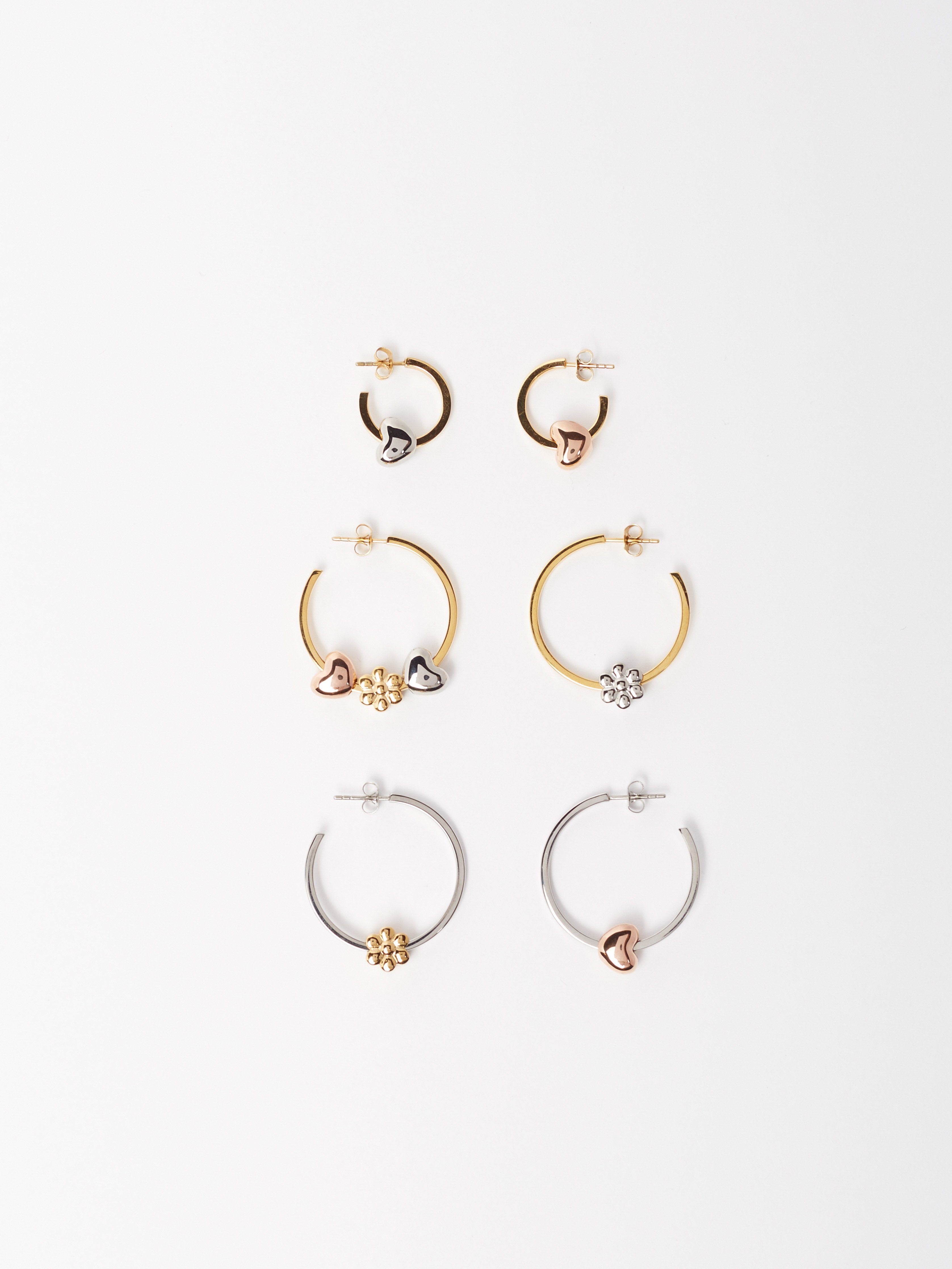 Flat lay view of Simple Silver Hoops Earrings with multi-bead set added  Bagatiba 
