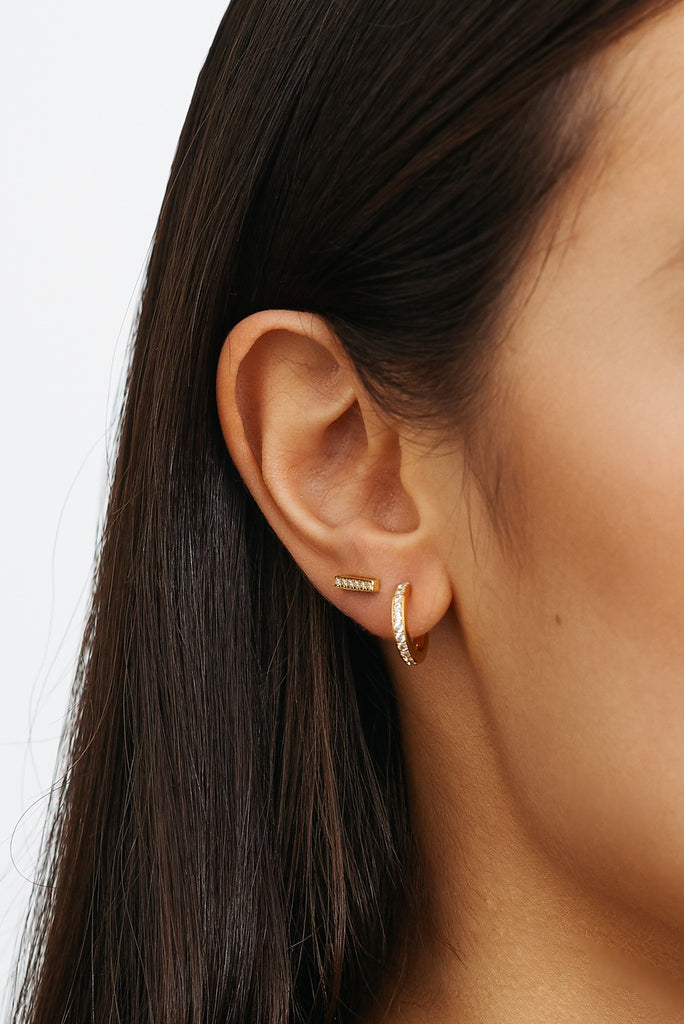 Cropped view on model's ear of Small Diamond Hoops Earrings Bagatiba 