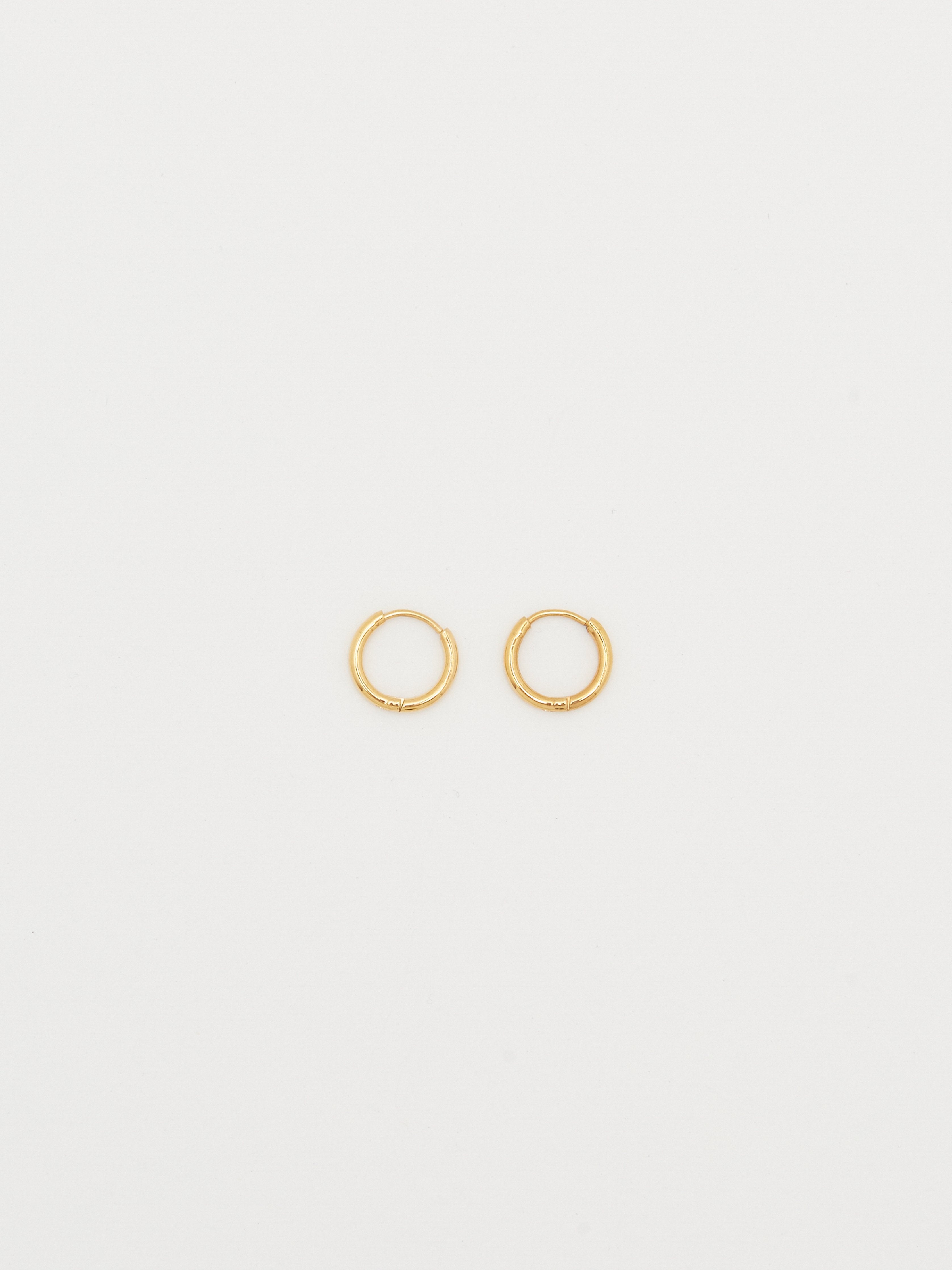 full view flat lay of Small Gold Eco Huggies Earrings Bagatiba 