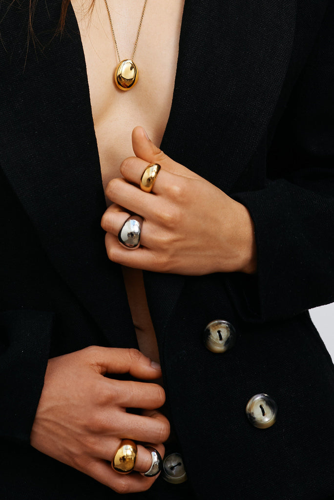 Model's torso view wearing the Small & Large Gold & Silver Orb Rings by bagatiba 