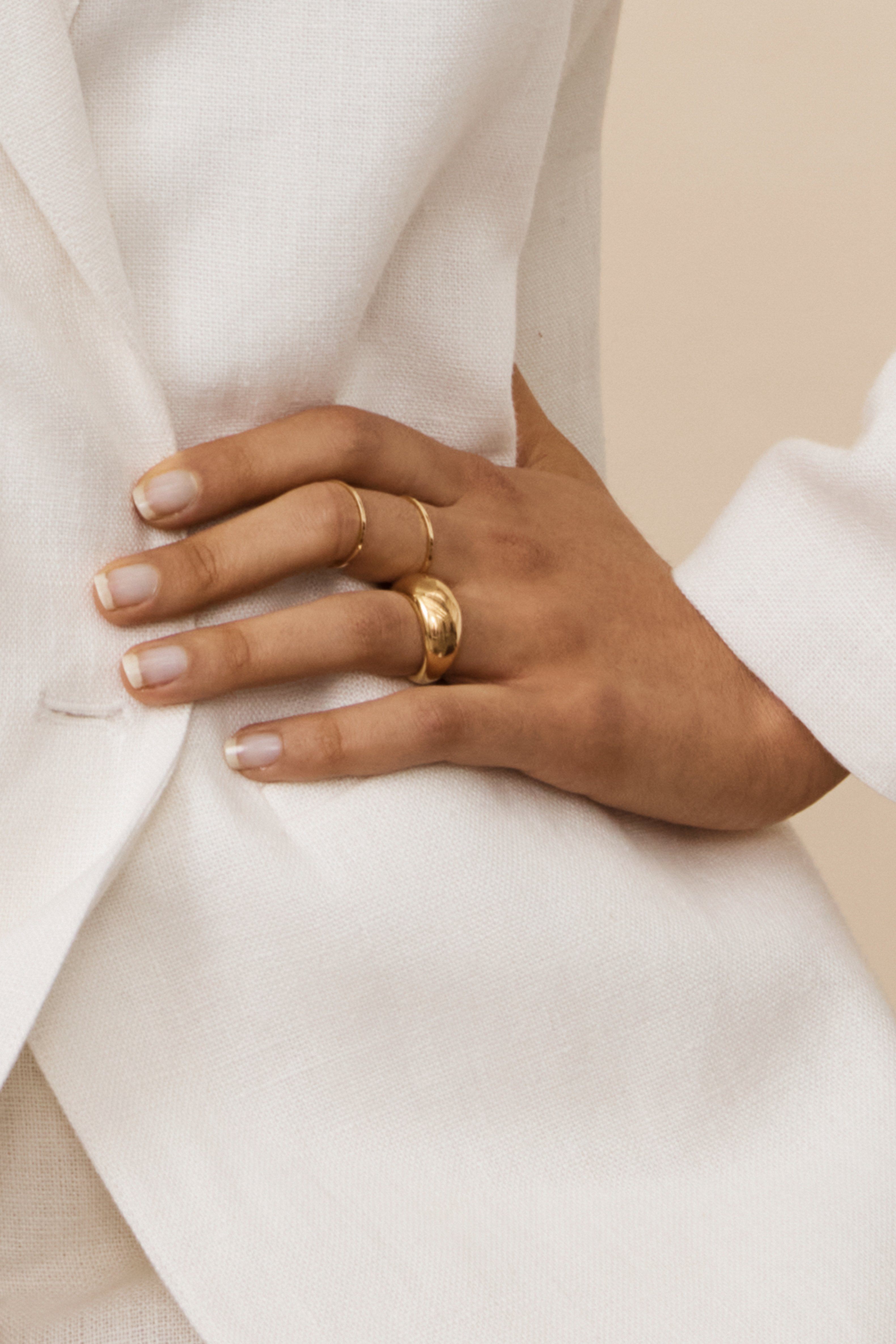 Detail view on model's hand of Small Gold Orb Ring Ring bagatiba 