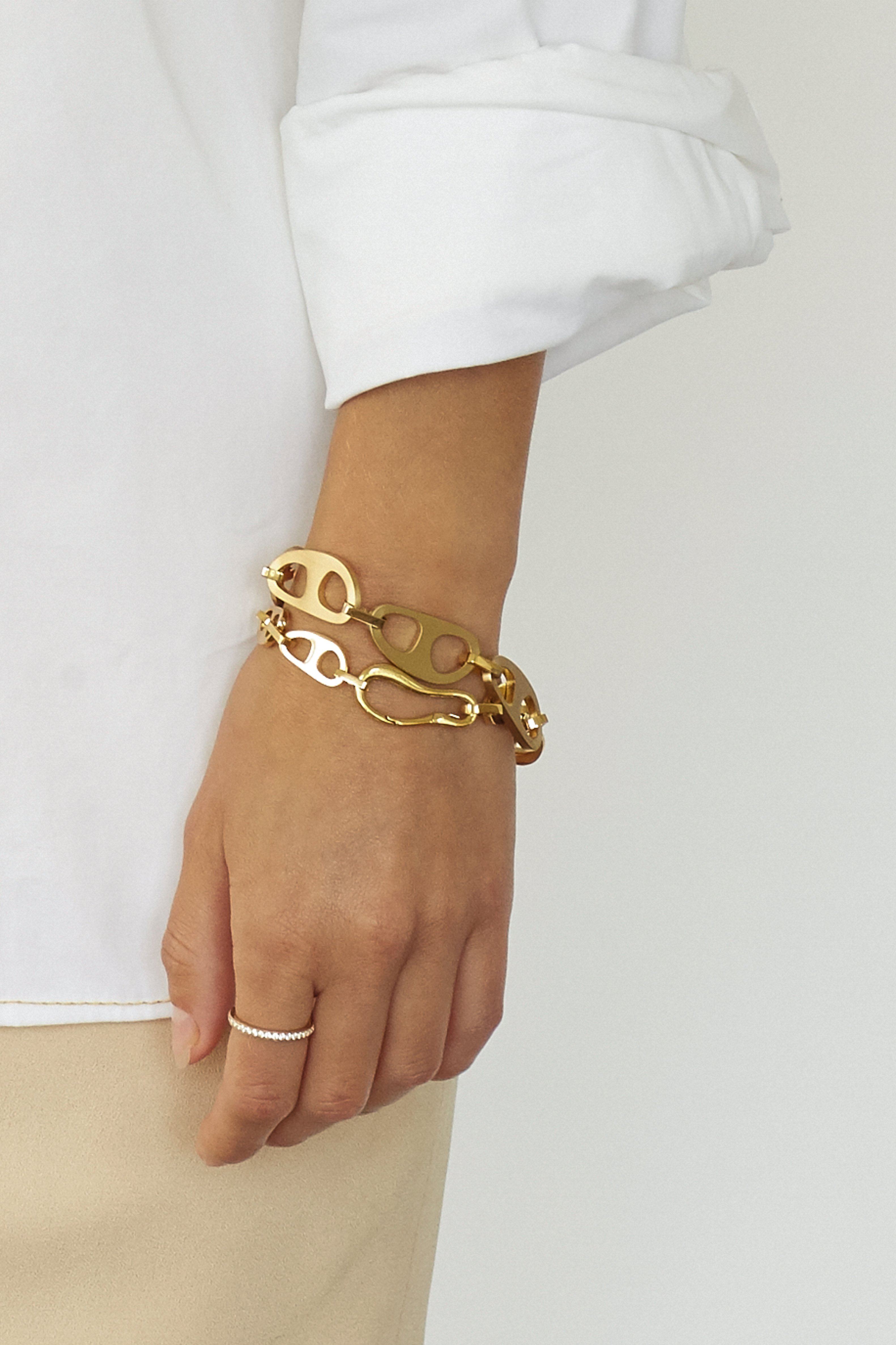 Small and Brushed Gold Tab Bracelets by bagatiba shown on wrist
