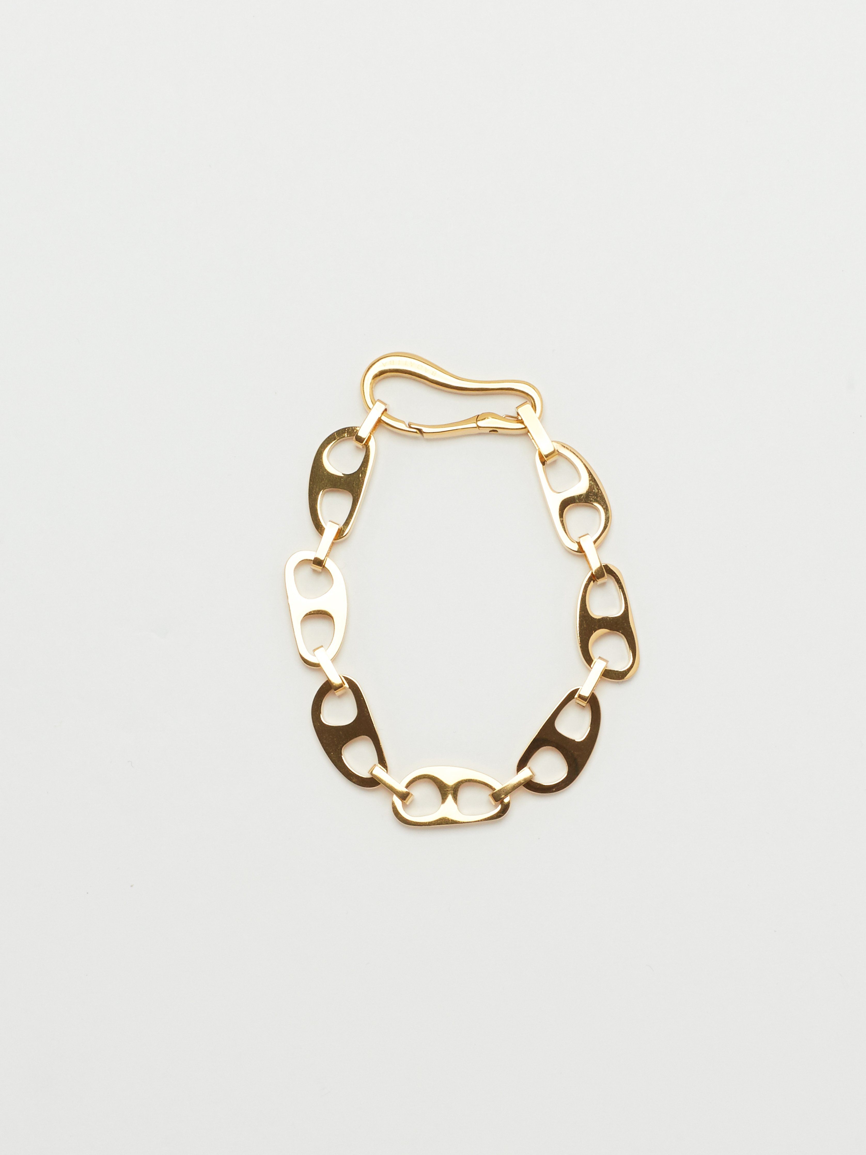 Detail view flat lay of the Small Gold Tab Bracelet Necklace bagatiba 