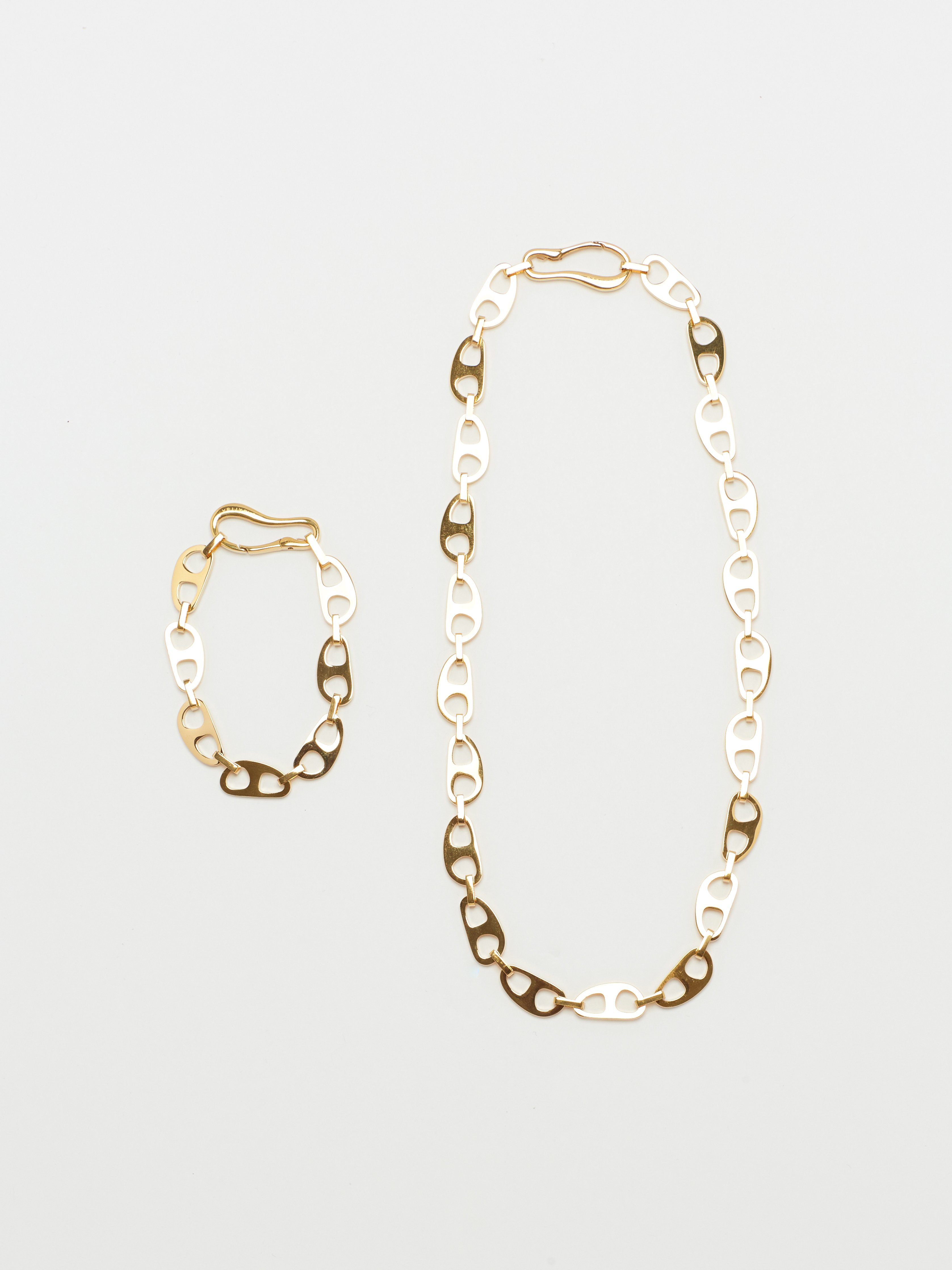 Full view flat lay of Small Gold Tab Necklace and Bracelet by bagatiba 