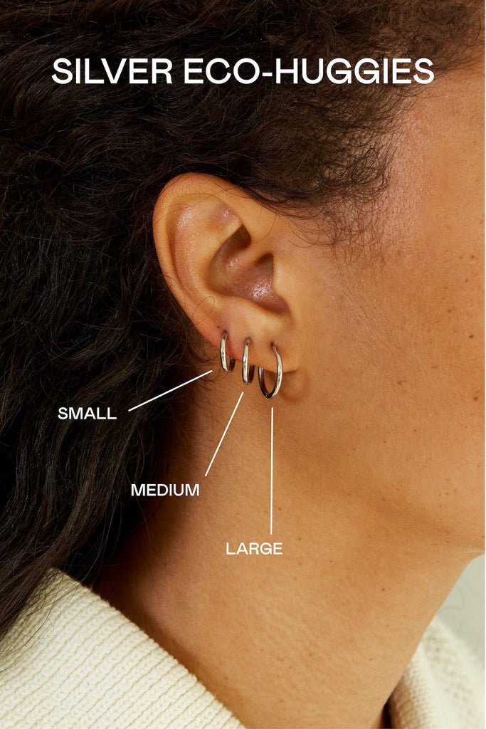 Small, Medium and Large Silver Eco Huggies Earrings by Bagatiba shown to scale on ear