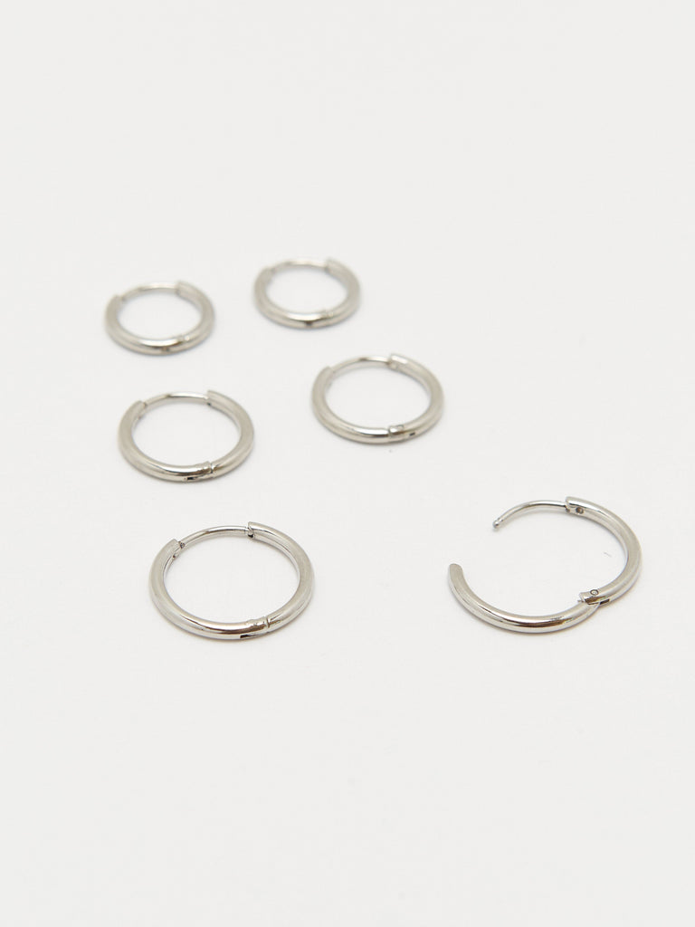 Detailed flat lay of Small Silver Eco Huggies Earrings Bagatiba 