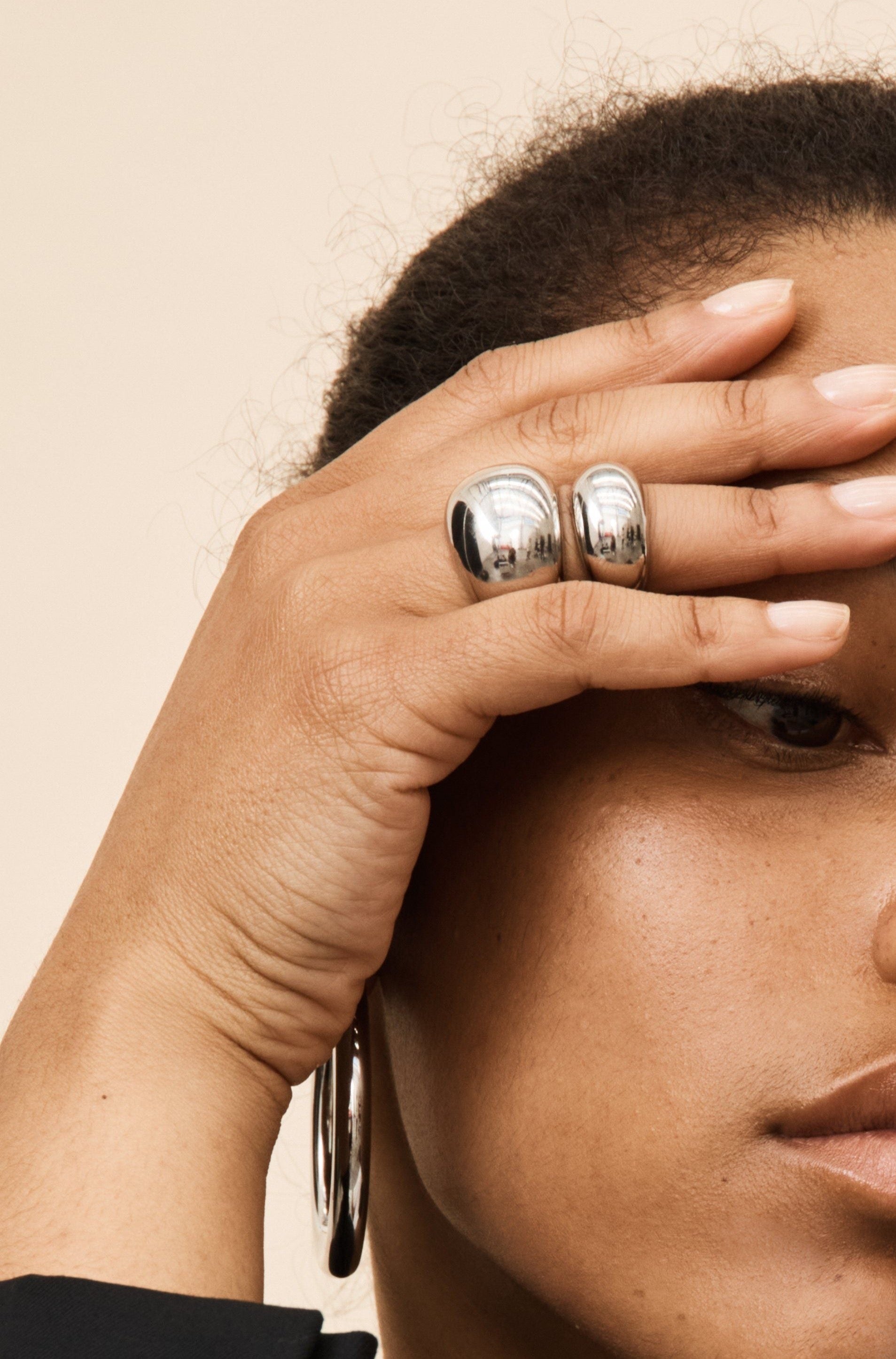 Small and Large Silver Orb Rings by bagatiba shown on model's hand