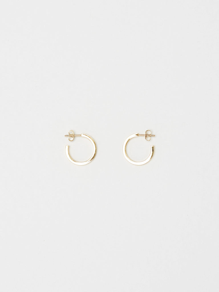 Full view flat lay of the Small Simple Gold Hoops Earrings Bagatiba 