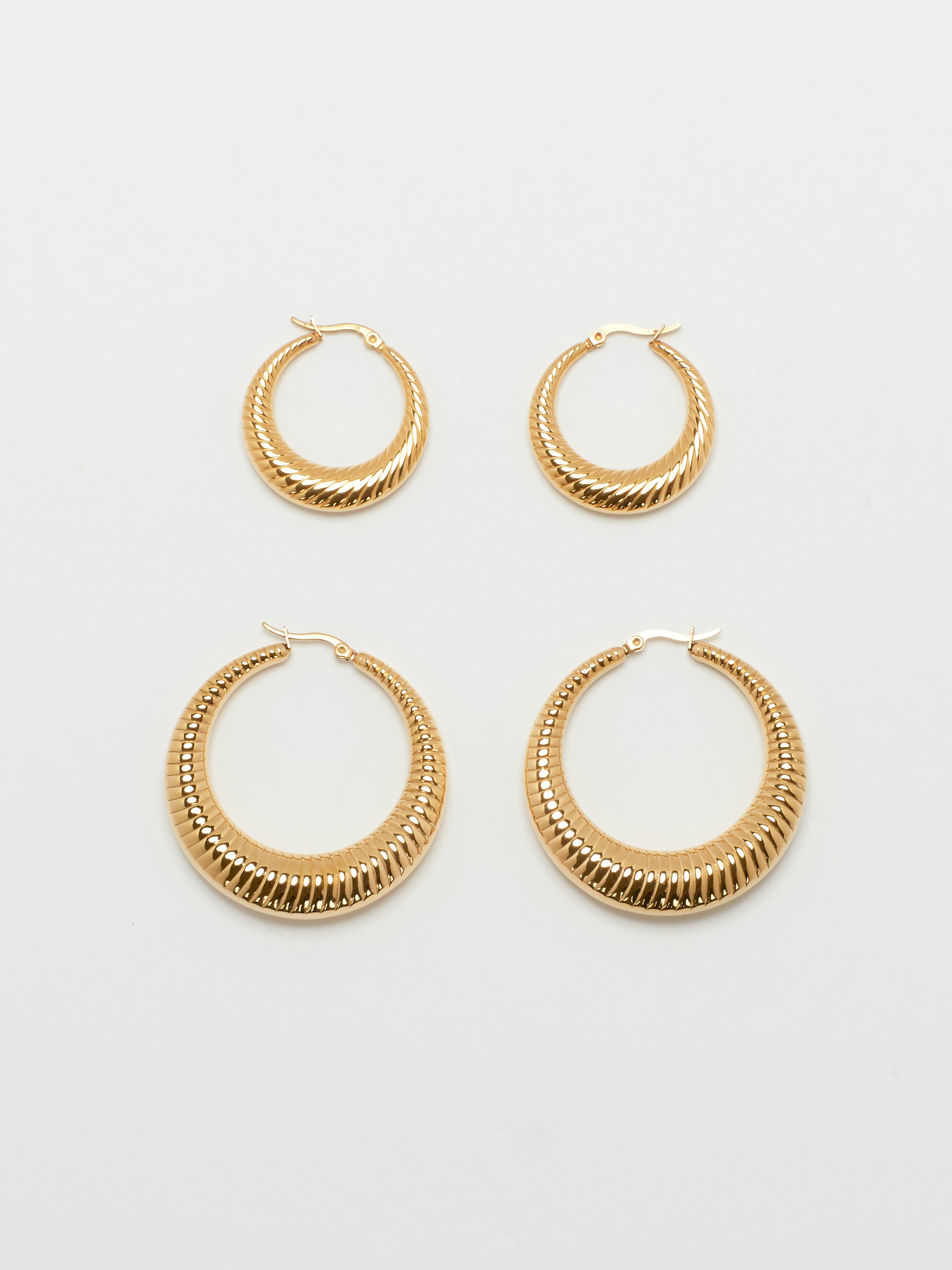 Full view flat lay of the Small Spiral Hoops and Spiral Hoops by bagatiba 
