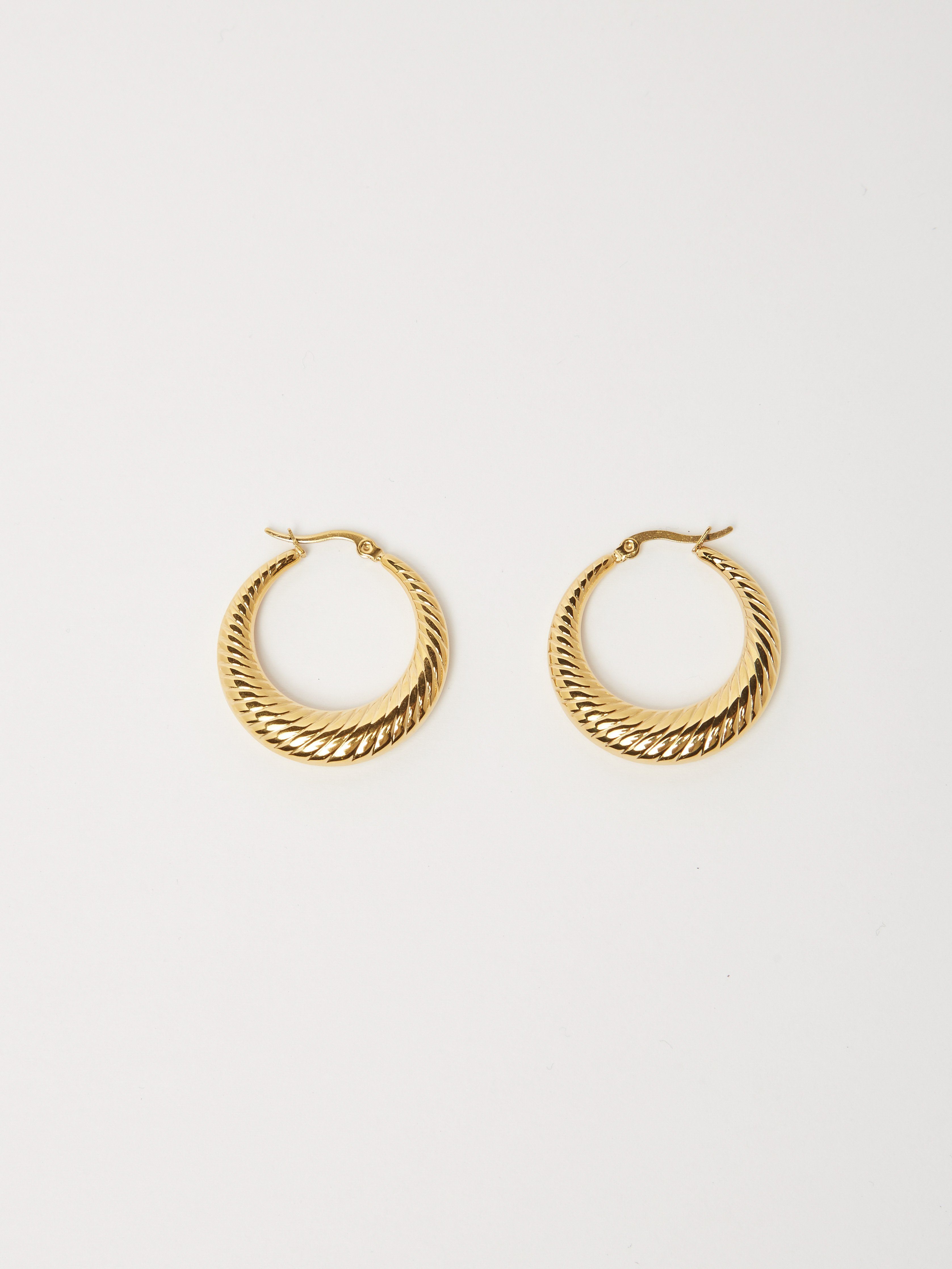 Flat lay view of Small Spiral Hoops Earrings bagatiba 