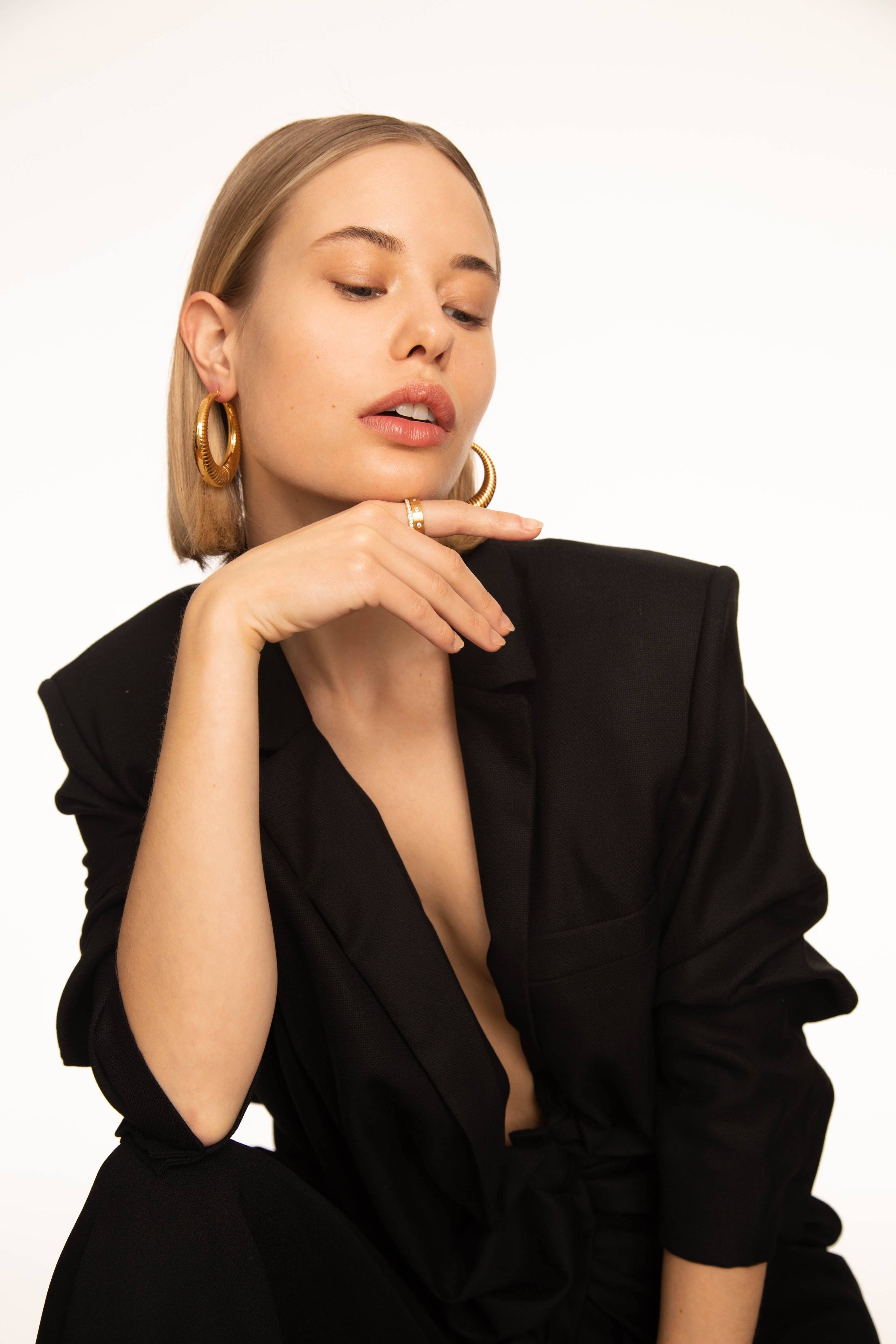 Model wearing the Spiral Hoops Earrings bagatiba 