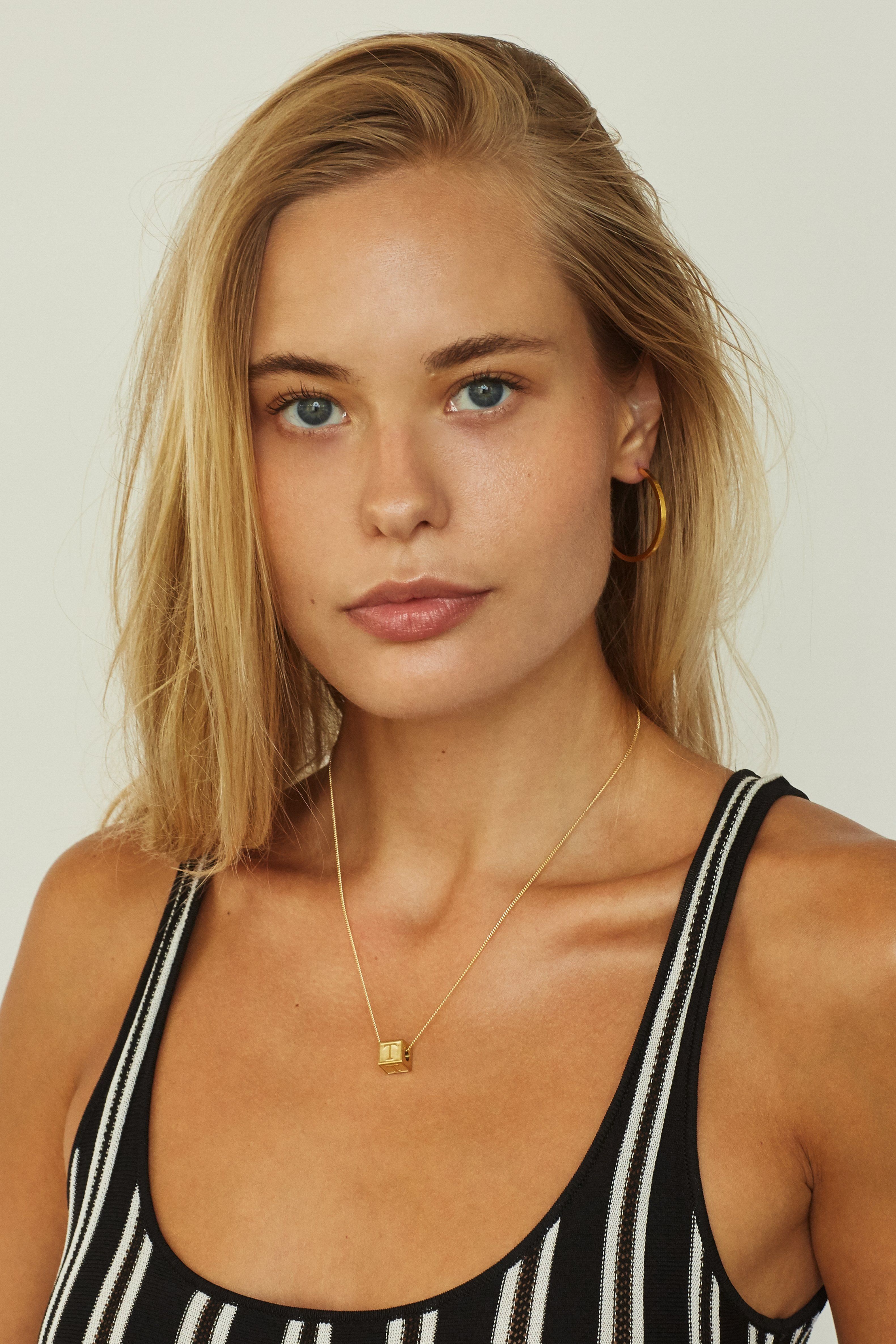 Model wearing "T" Letter Block letters Bagatiba 