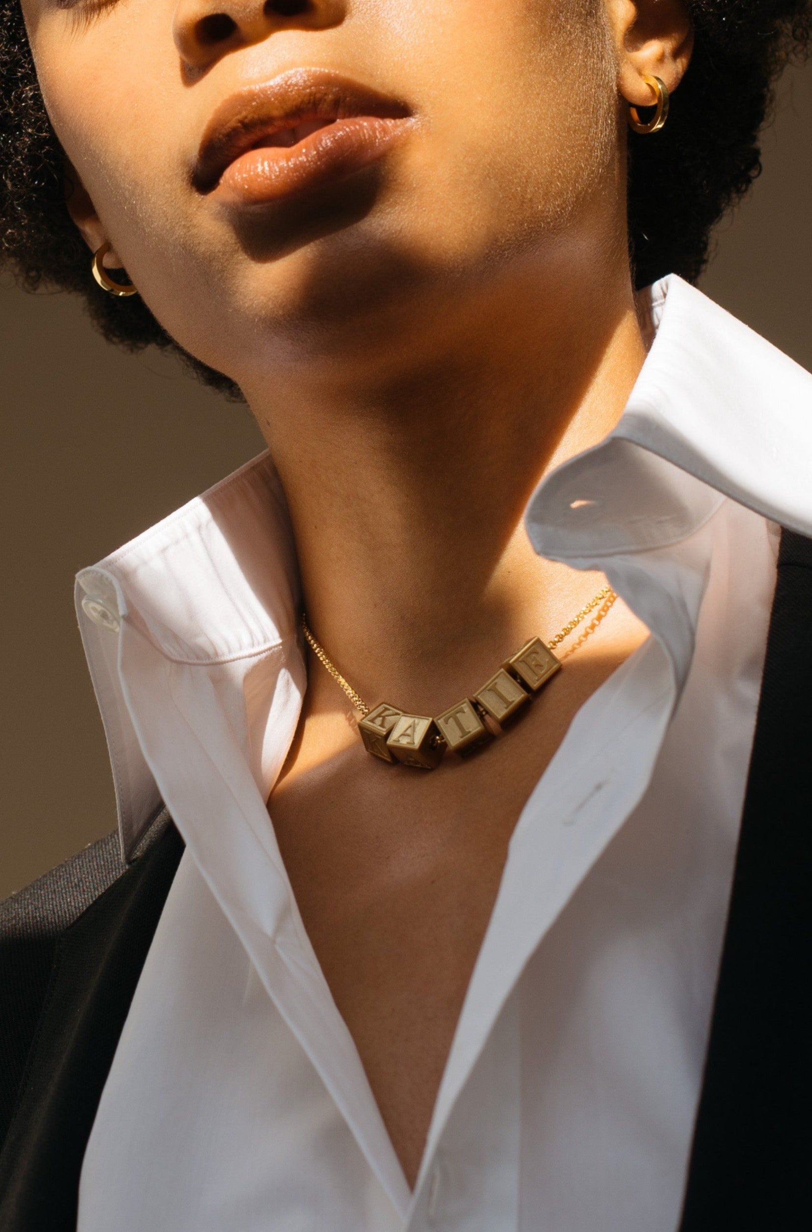 Model wearing 5 Letter Block letters on choker chain Bagatiba