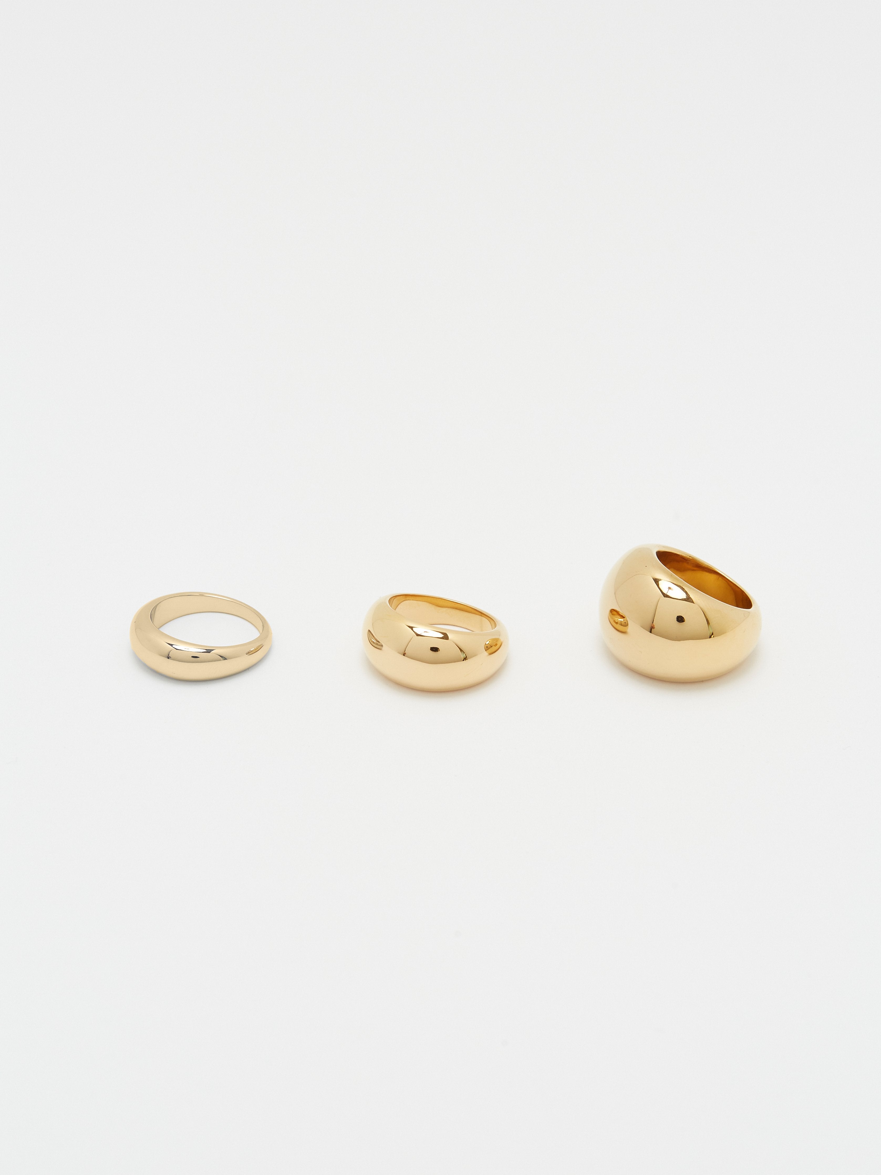 Flat lay of Thin, Small and Large Gold Orb Rings by bagatiba 