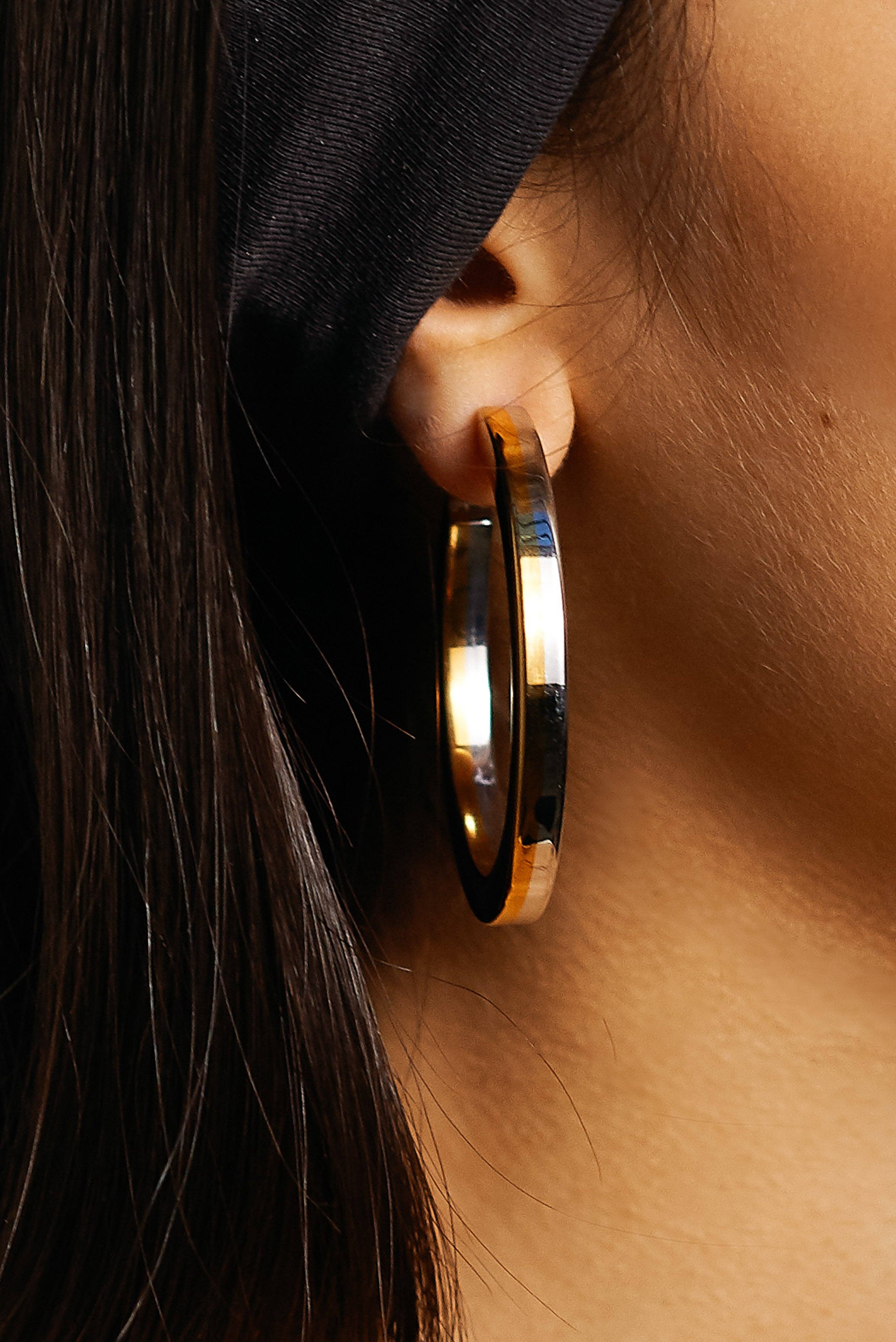 Detail view on ear of Two Tone Flat Hollow Hoops Earrings Bagatiba 