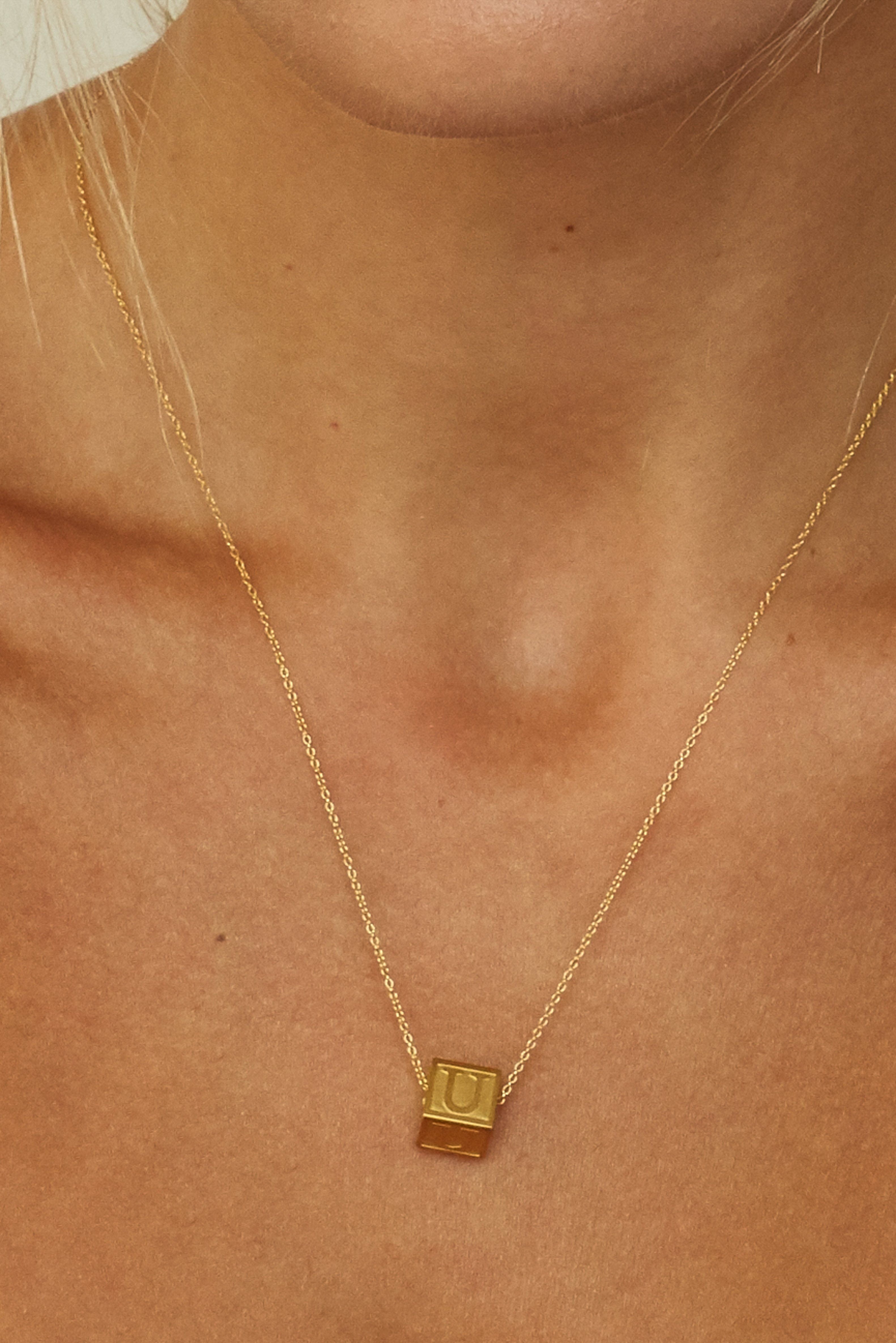 Cropped view on model "U" Letter Block letters on 16" + 2" Chain  Bagatiba 