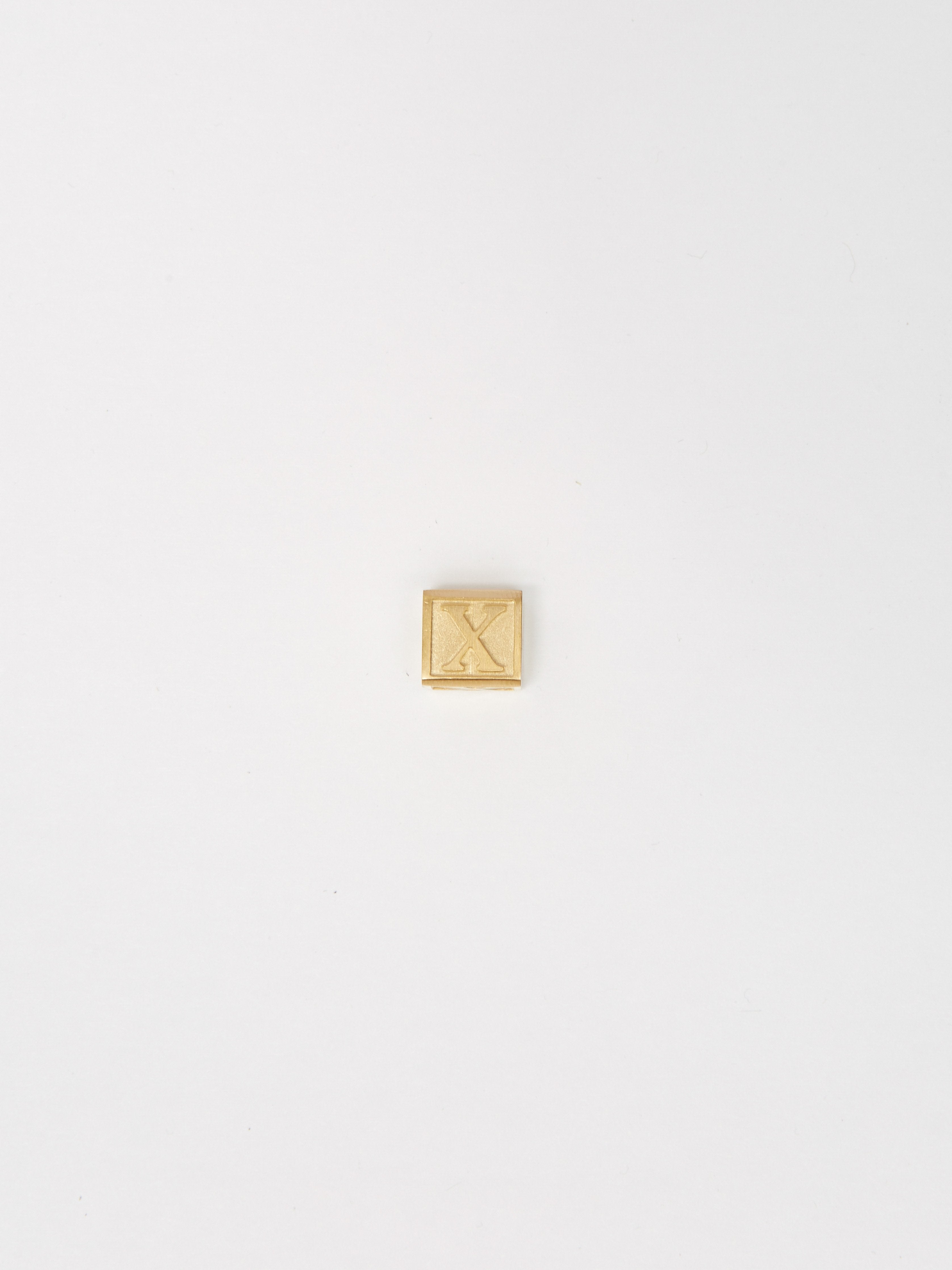 Full view flat lay "X" Letter Block letters Bagatiba 